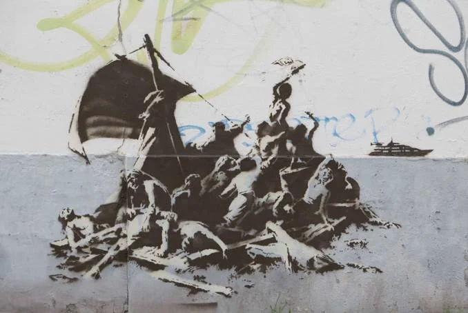 We’re not all in the same boat,” 2015; Banksy