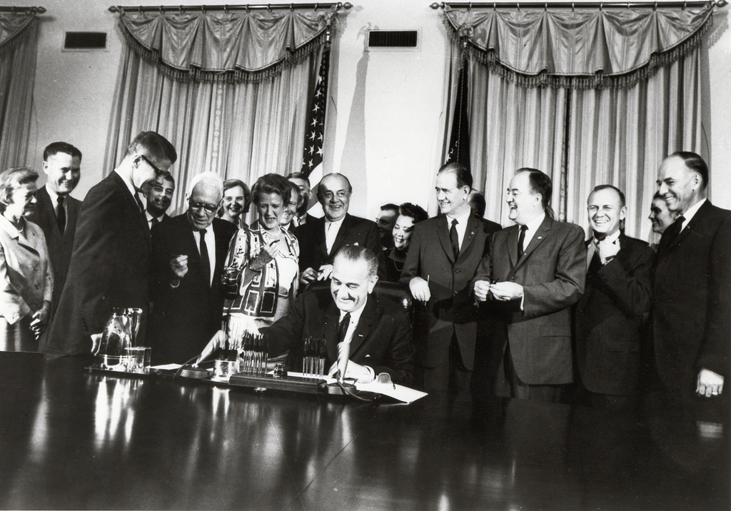 President Johnson signing the Food Stamp Act of 1964. Credit