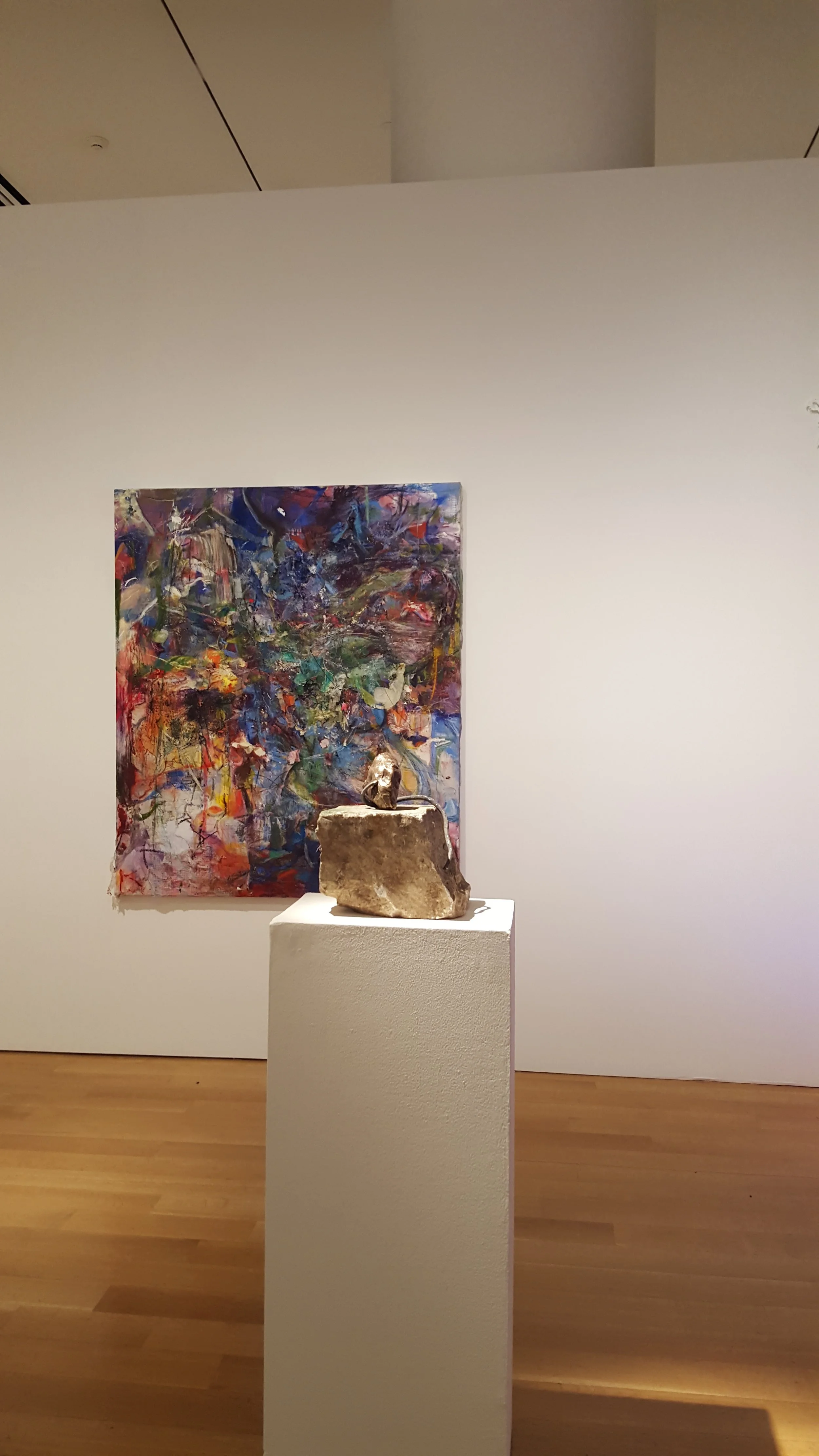 The sculpture has something to do with paying attention, namely, listening. bronze, steel, stoop marble