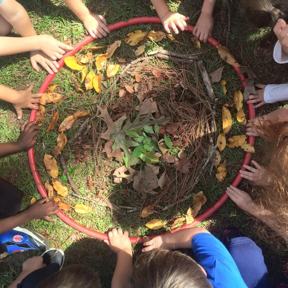 These kindergarteners loved working together on this collaborative mandala! The hula hoop helps the little ones keep the circular shape.