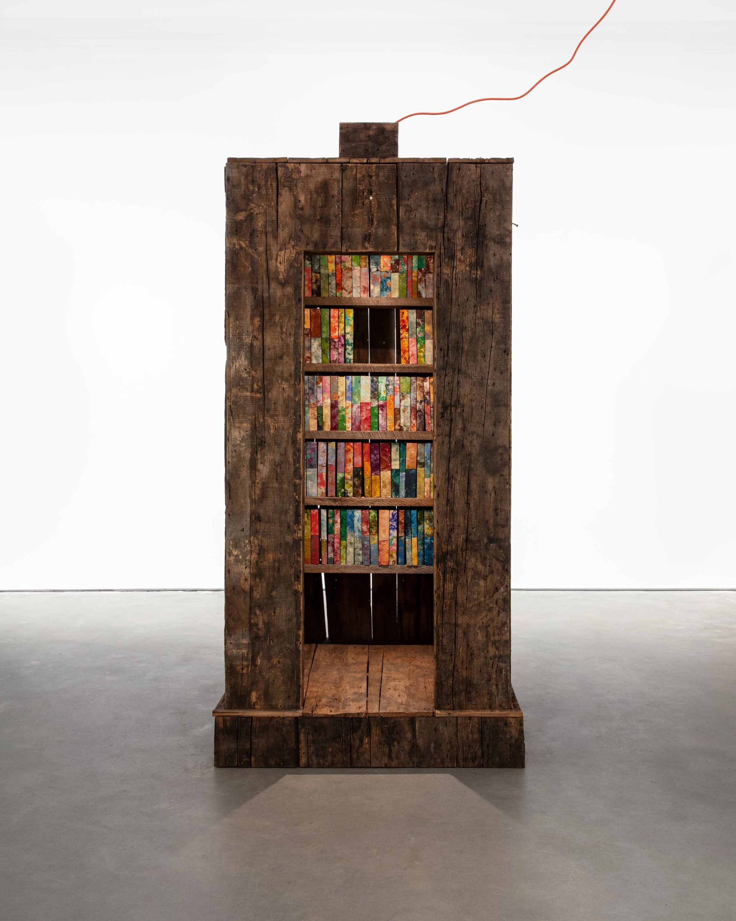 Library of Paper Towels /
2024 /
252 hand made books - oil stick, paper towels, book board, glue. 1 library - 18th century American Chestnut, rough cut timber, hat light, extension chord. /
48 x 48 x 108 inches