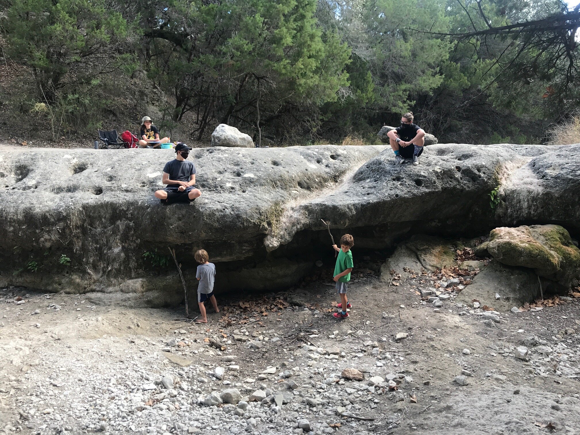 Hanging out at our favorite waterfall spot, sans the water