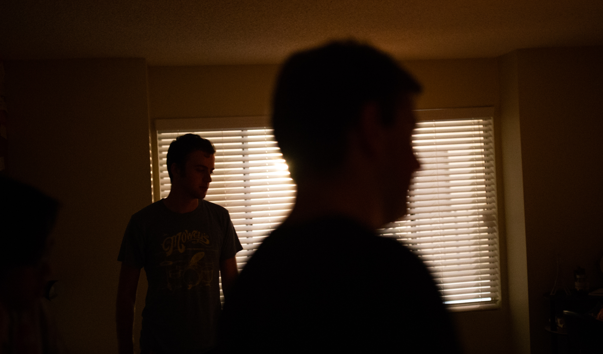 2nd assistant camera Brady Petrik, left, and director Tyler Aquilina plan shooting the next scene.