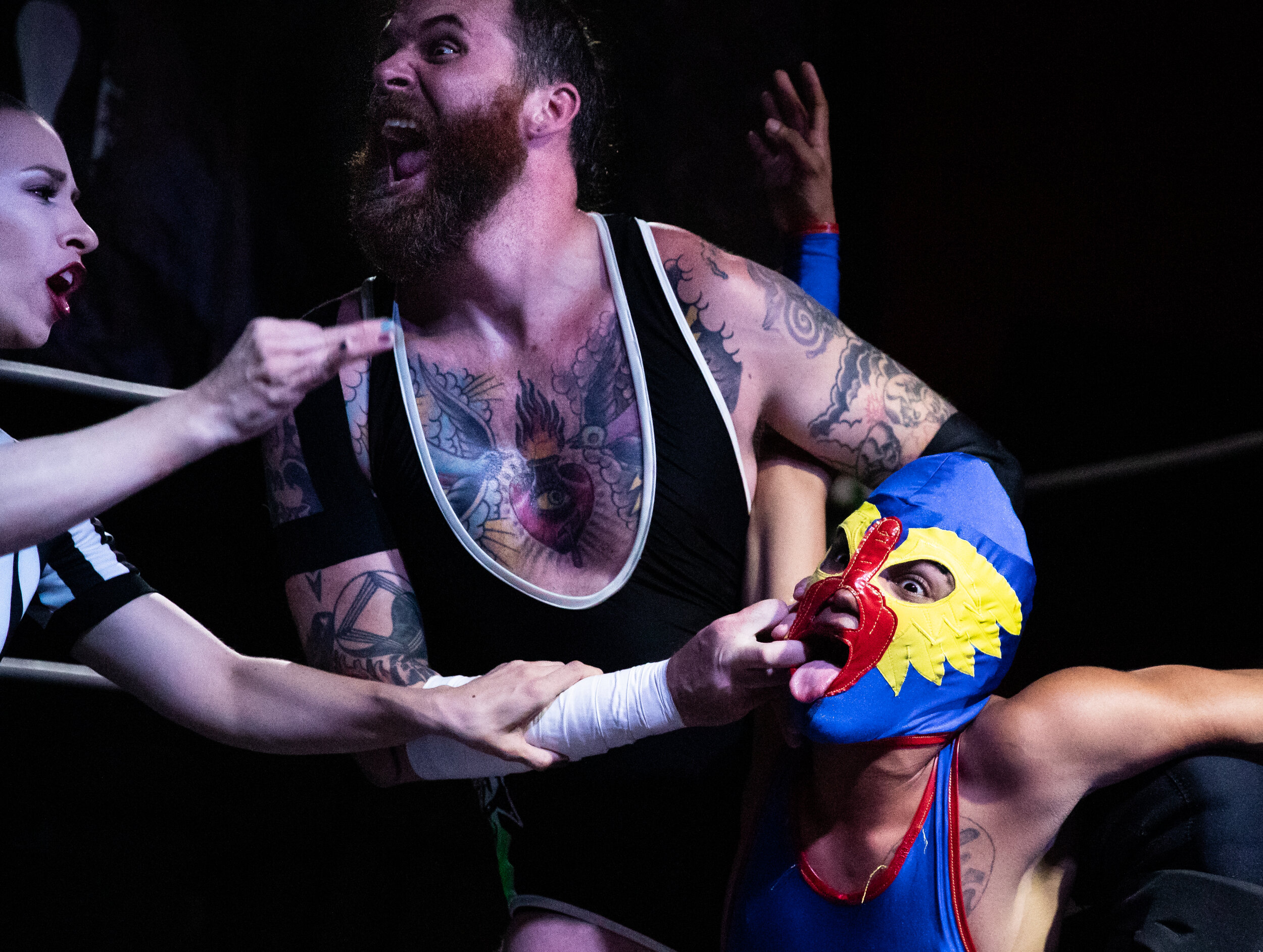  Referee Aubrey "Gearl Hebner" Edwards, left, tries to intervene during the wrestling match between Steve West, center, and lucha "The Bird” on Friday night's 3-2-1 Battle wrestling event at Evolv Fitness in Seattle on October 4, 2019. "I grew up as 