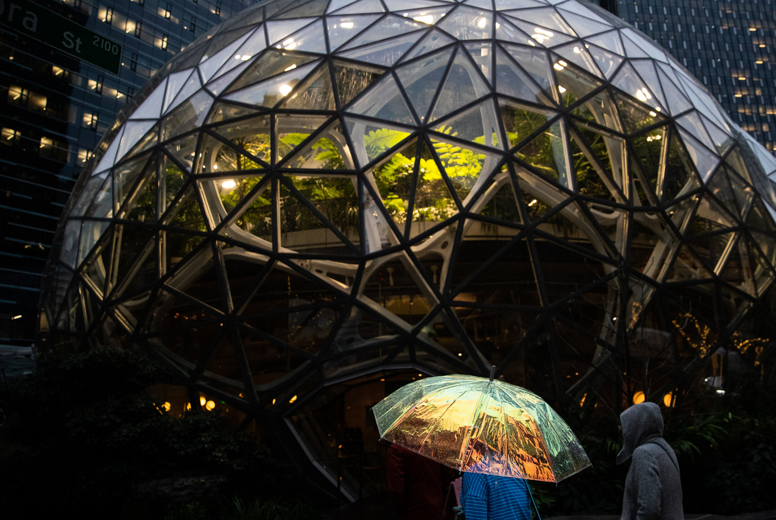  Erika North shield herself from the rain with her umbrella outside the Amazon Spheres in Seattle on Dec. 20, 2019. 