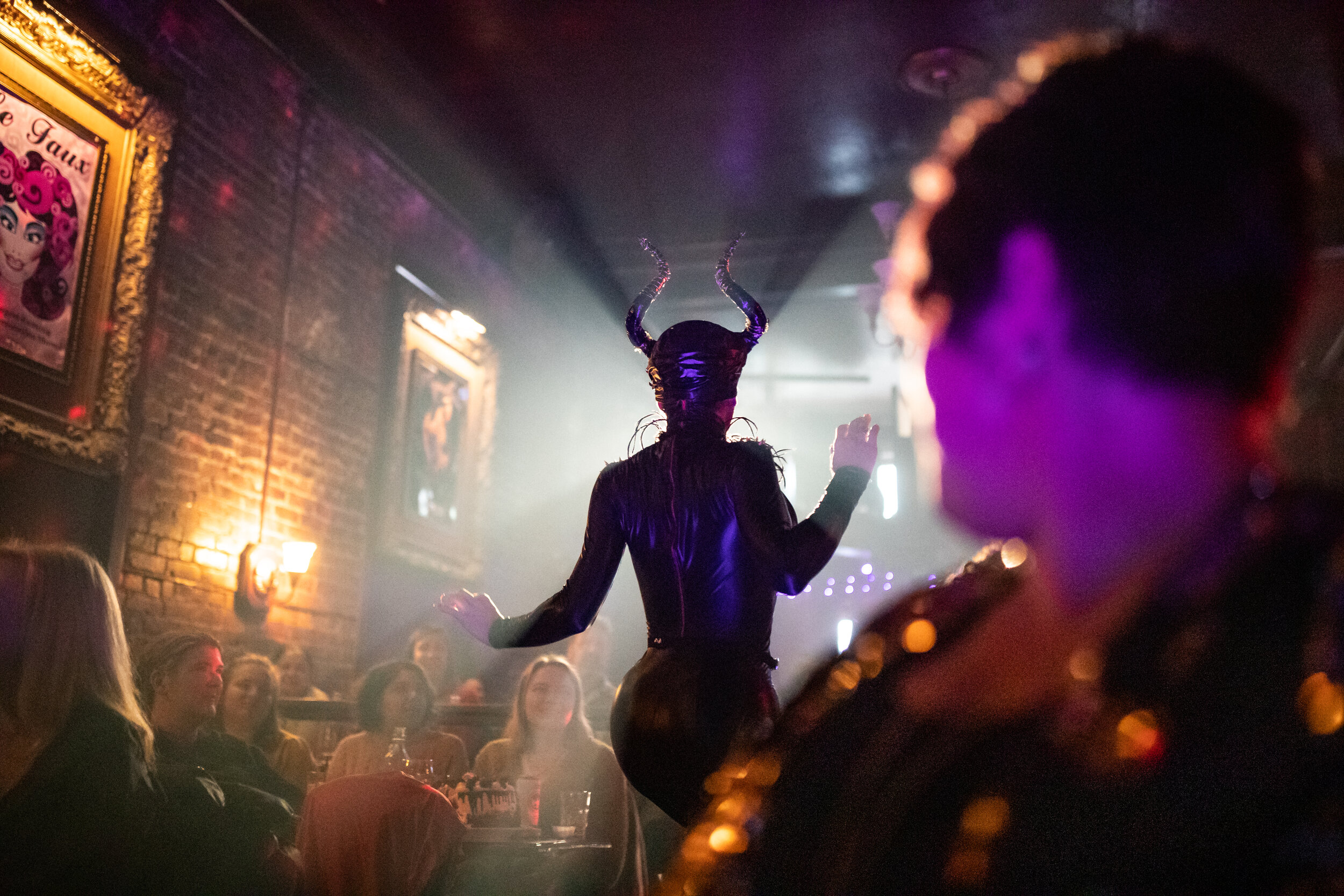  Performer Lucy Paradisco dances in the aisle during the weekly Le Faux Queen of the Brunch drag show at Julia's On Broadway on Dec. 28, 2019. 