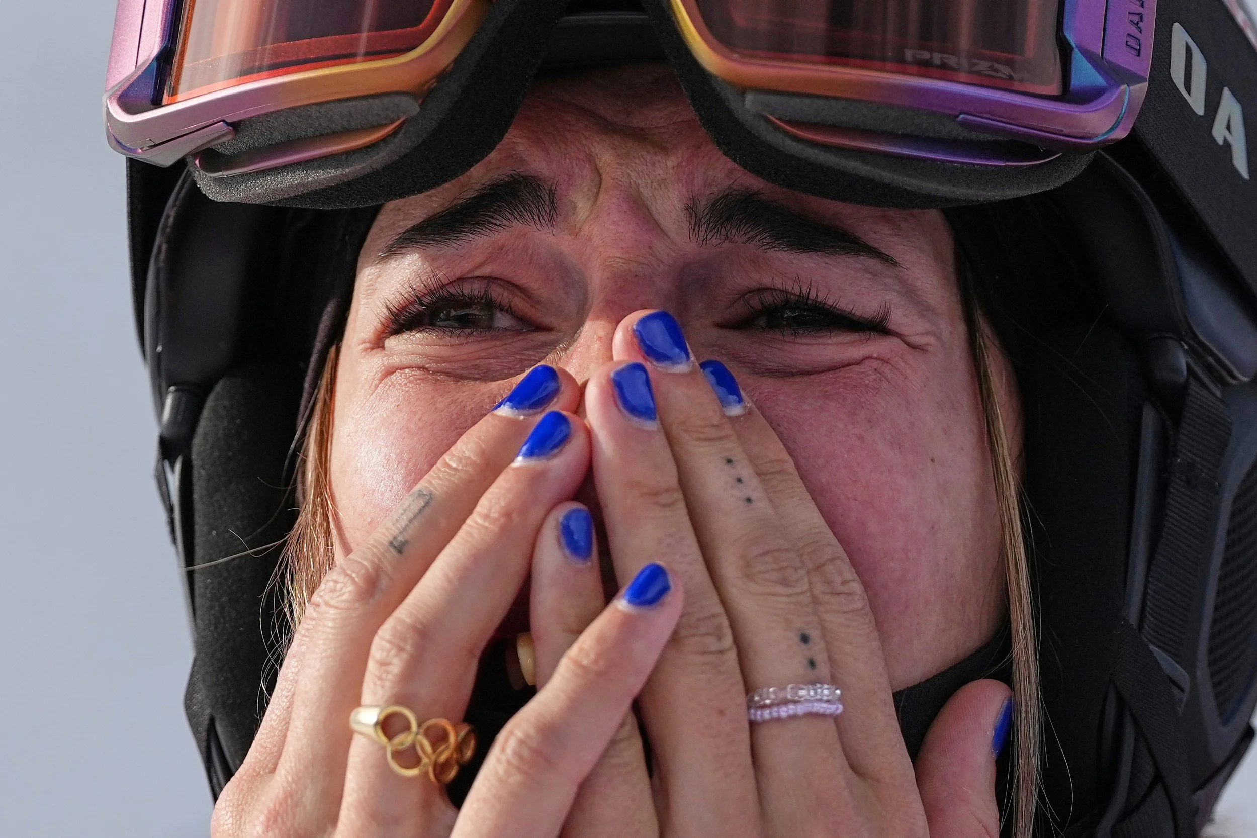  France's Perrine Laffont reacts to winning the bronze medal in the women's freestyle skiing moguls finals at the 2026 Winter Olympics, in Livigno, Italy, Wednesday, Feb. 11, 2026. (AP Photo/Gregory Bull) 