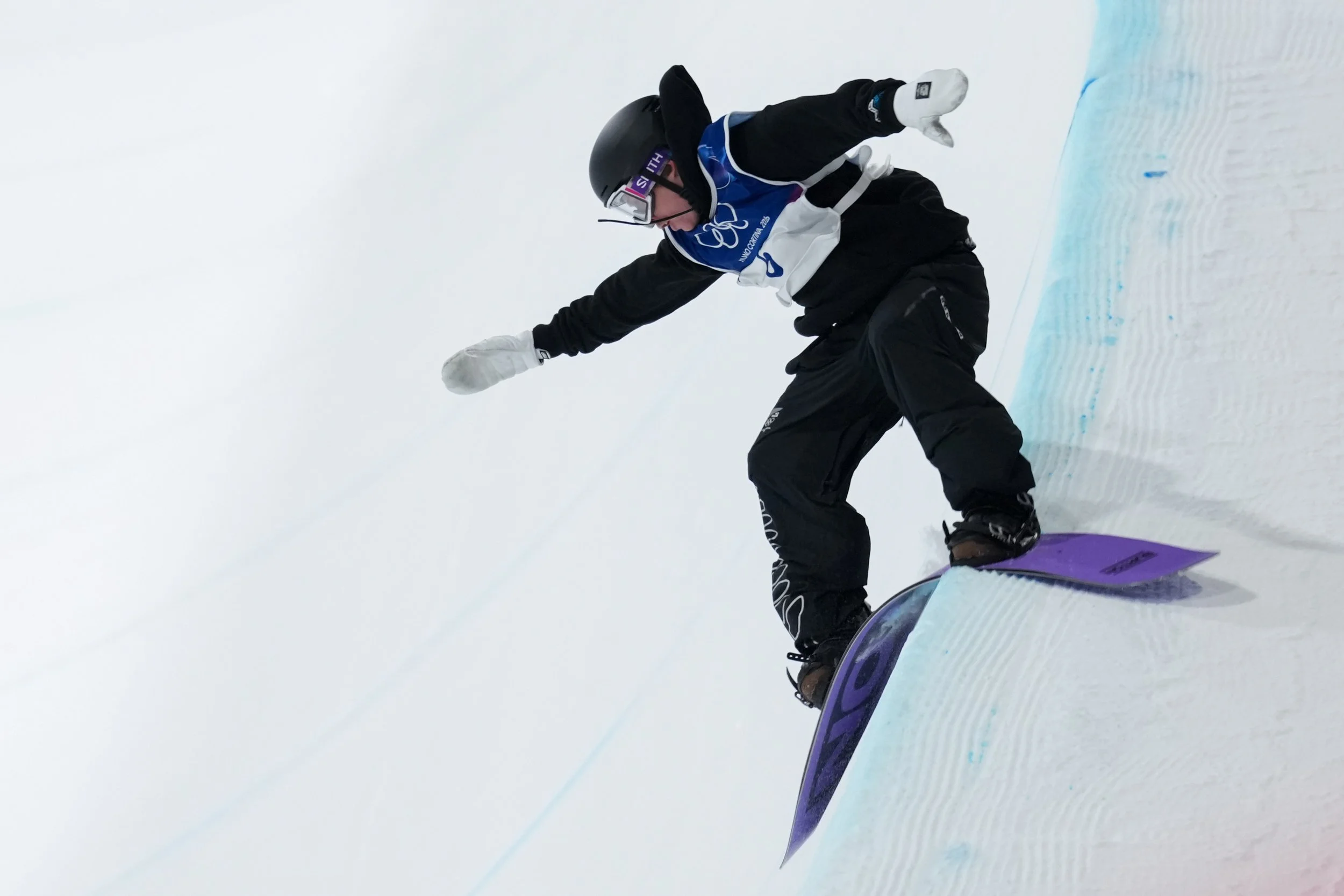  New Zealand's Campbell Melville Ives lands during the men's snowboarding halfpipe finals at the 2026 Winter Olympics, in Livigno, Italy, Friday, Feb. 13, 2026. (AP Photo/Abbie Parr) 