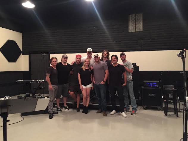 Kimberly with client Jarred Pierce and band at rehearsals. The only woman in the room!