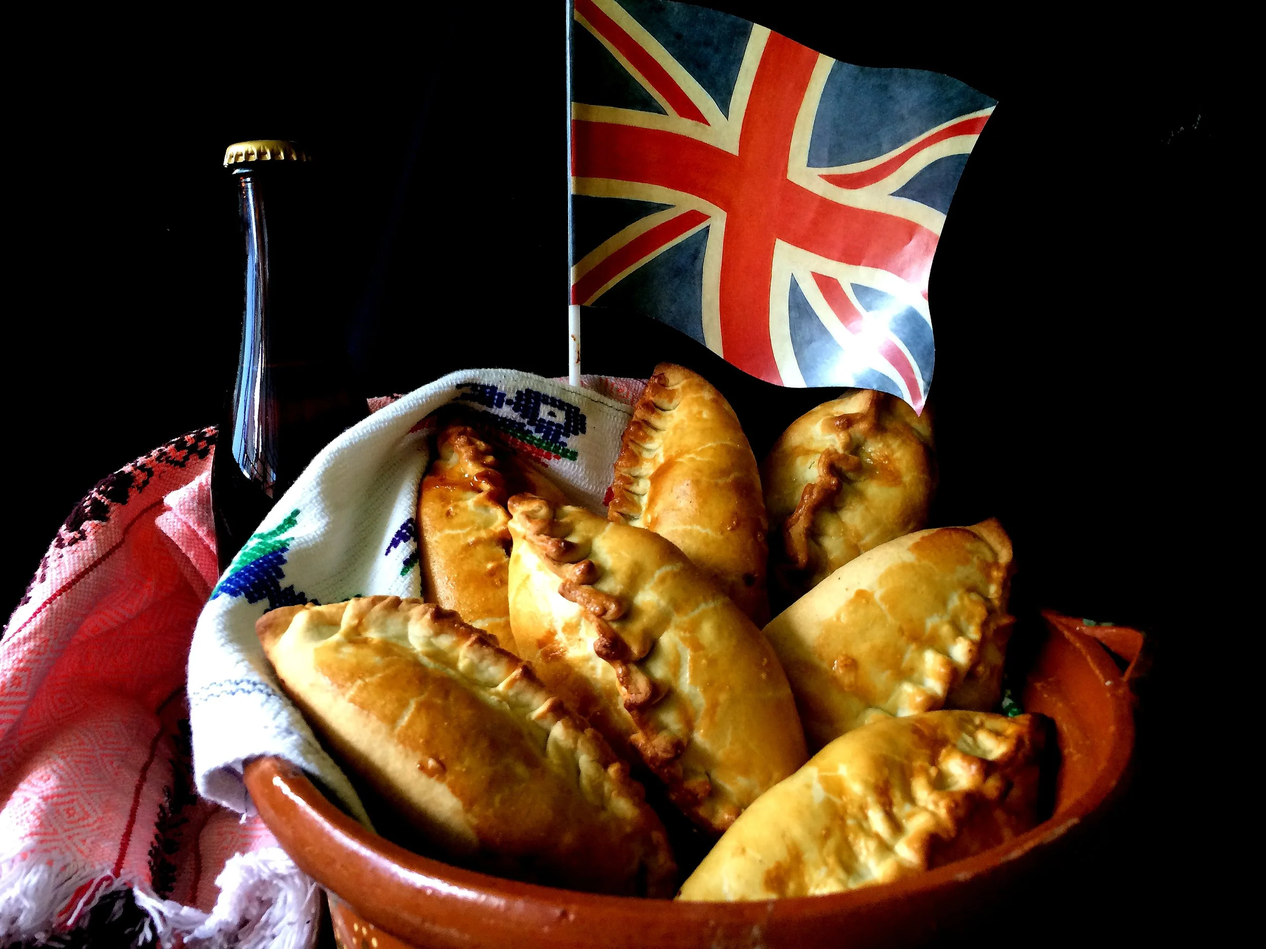 Subterranean Snacks: Cornish Pasties in 19th Century Mexico
96
Normal
0
false
false
false
EN-US
X-NONE
X-NONE
/* Style Definitions */
table.MsoNormalTable
{mso-style-name:"Table Normal";
mso-tstyle-rowband-size:0;
mso-tstyle-colband-size:0;
mso-style-noshow:yes;
mso-style-priority:99;
mso-style-parent:"";
mso-padding-alt:0in 5.4pt 0in 5.4pt;
mso-para-margin:0in;
mso-para-margin-bottom:.0001pt;
mso-pagination:widow-orphan;
font-size:12.0pt;
font-family:Calibri;
mso-ascii-font-family:Calibri;
mso-ascii-theme-font:minor-latin;
mso-hansi-font-family:Calibri;
mso-hansi-theme-font:minor-latin;}
Struggling to decide what to have for lunch today? Take a tip from history & pack a pie! This week, The Feast explores how the pastry pie was the original grab & go lunch option, from the Ottoman börek to the Cornish pasty to the Hot Pocket. Although the Cornish pasty may be an icon of English cuisine, learn how a small town in the mountains of Mexico made this traditional mining meal their own. Plus, all the EU pastry laws you can handle on this week’s special collaboration episode featuring Rocio Carvajal & PassTheChipotle.com