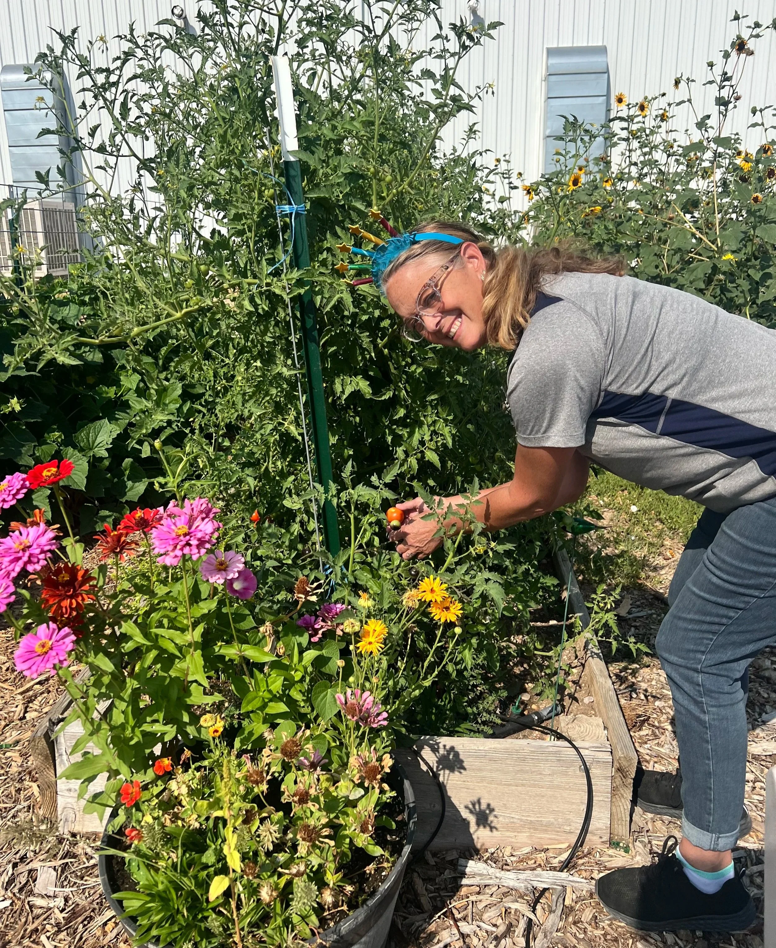 A WCA staff member tending to the organic garden