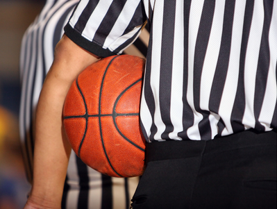 Referee holding a basketball
