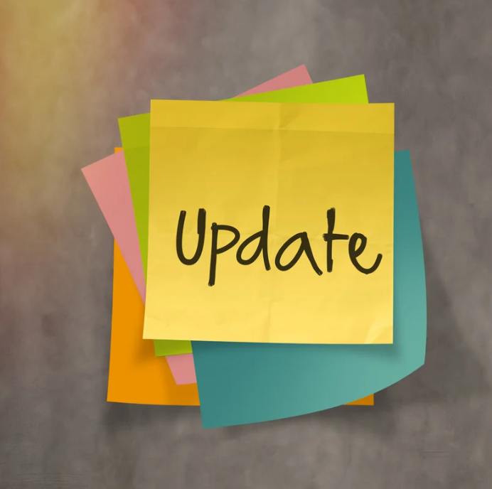 The word "update" on a stack of multi-colored sticky notes