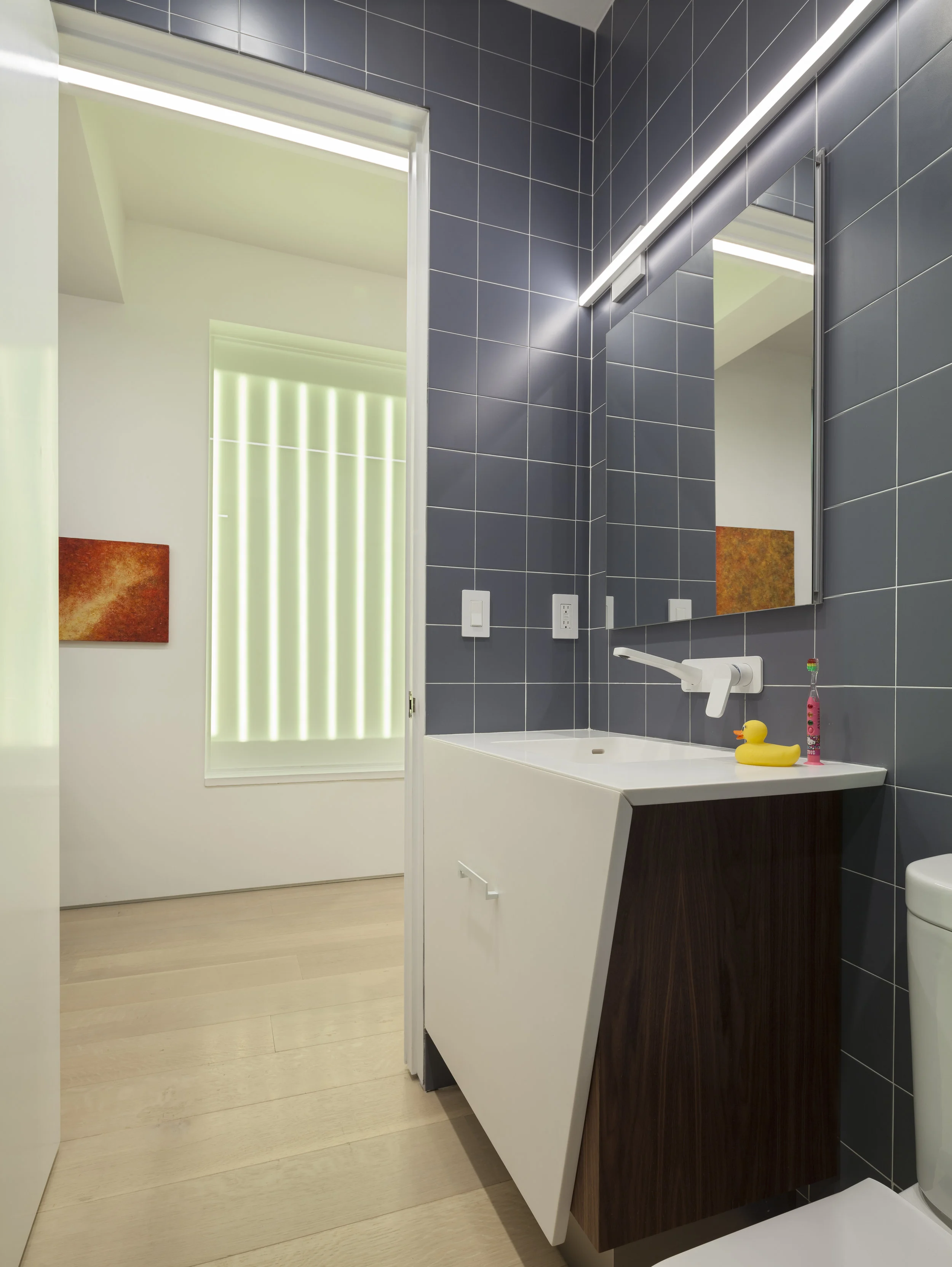 Facing the custom vanity and outward to the color LED “window”. Photo by Brad Dickson