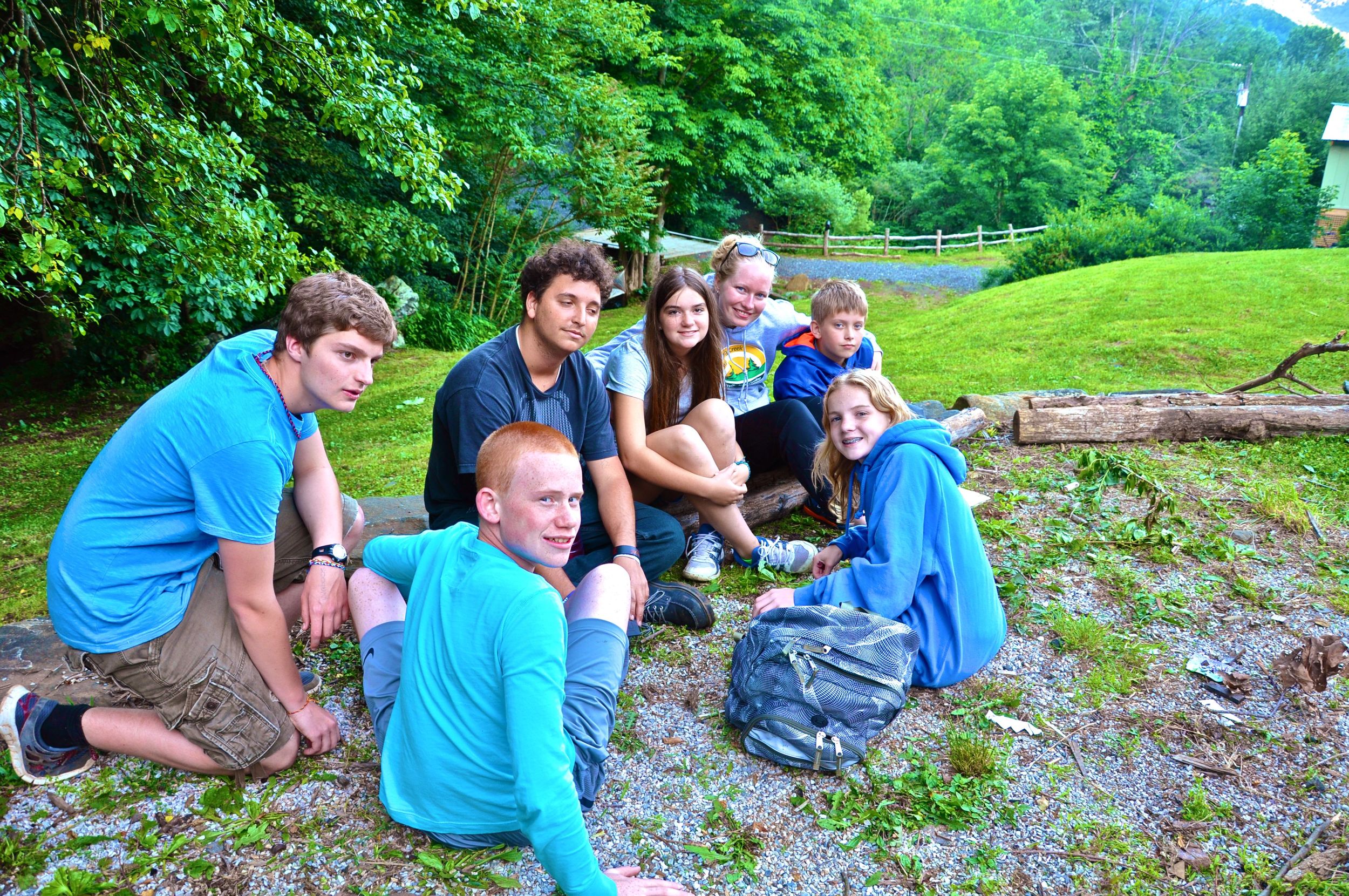 group-huddle-around-the-fire-before-it-gets-dark-and-the-smores-come-out.jpg