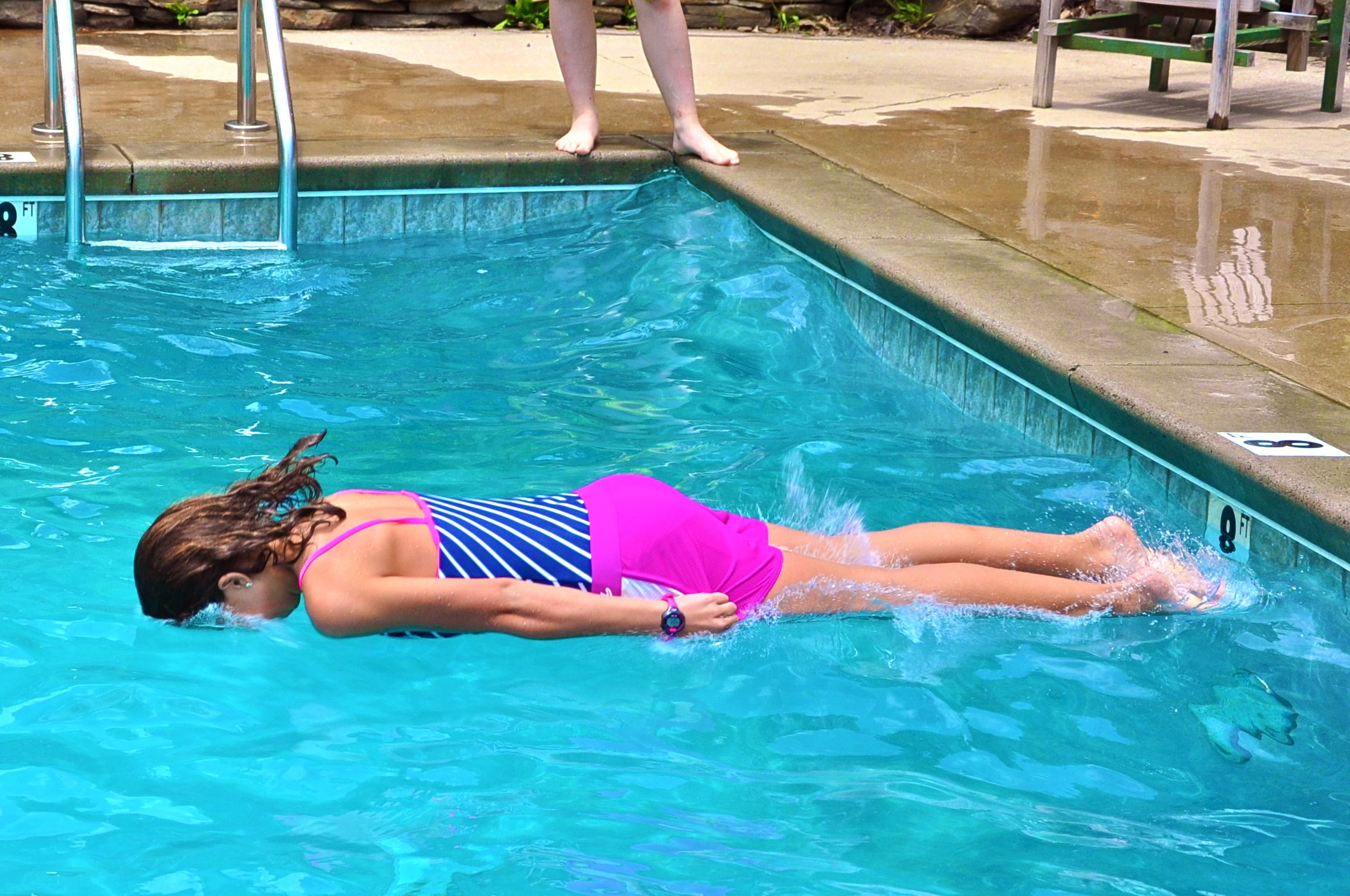 emma-displays-a-perfect-log-drop-into-the-pool.jpg