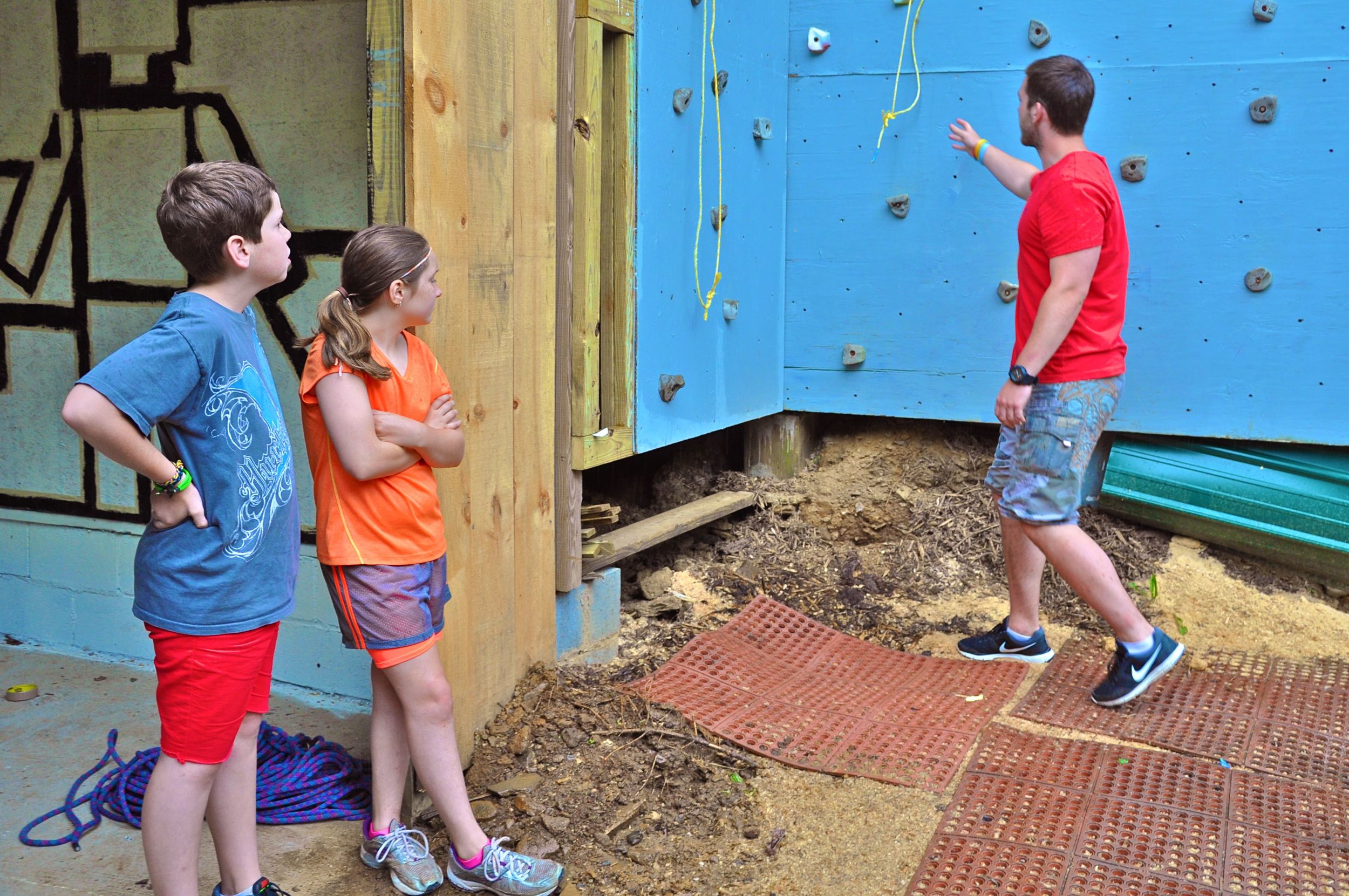 james-explains-the-climbing-wall-rules-to-winston-and-olivia.jpg