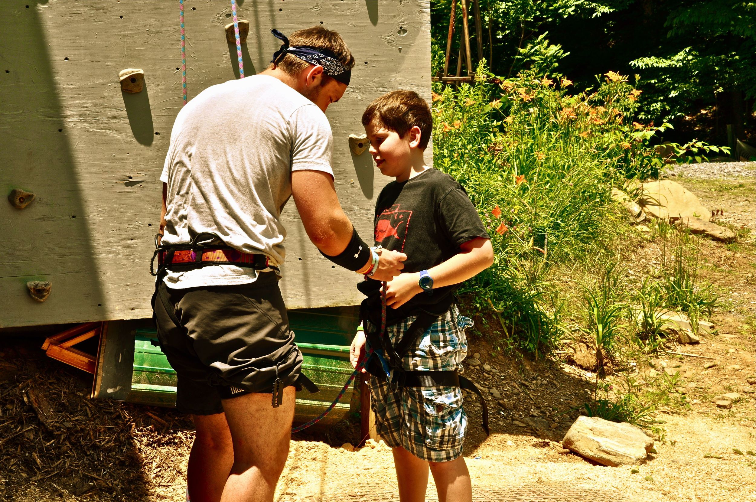 winston-gets-all-harnassed-up-for-his-first-climb-up-the-rock-wall.jpg