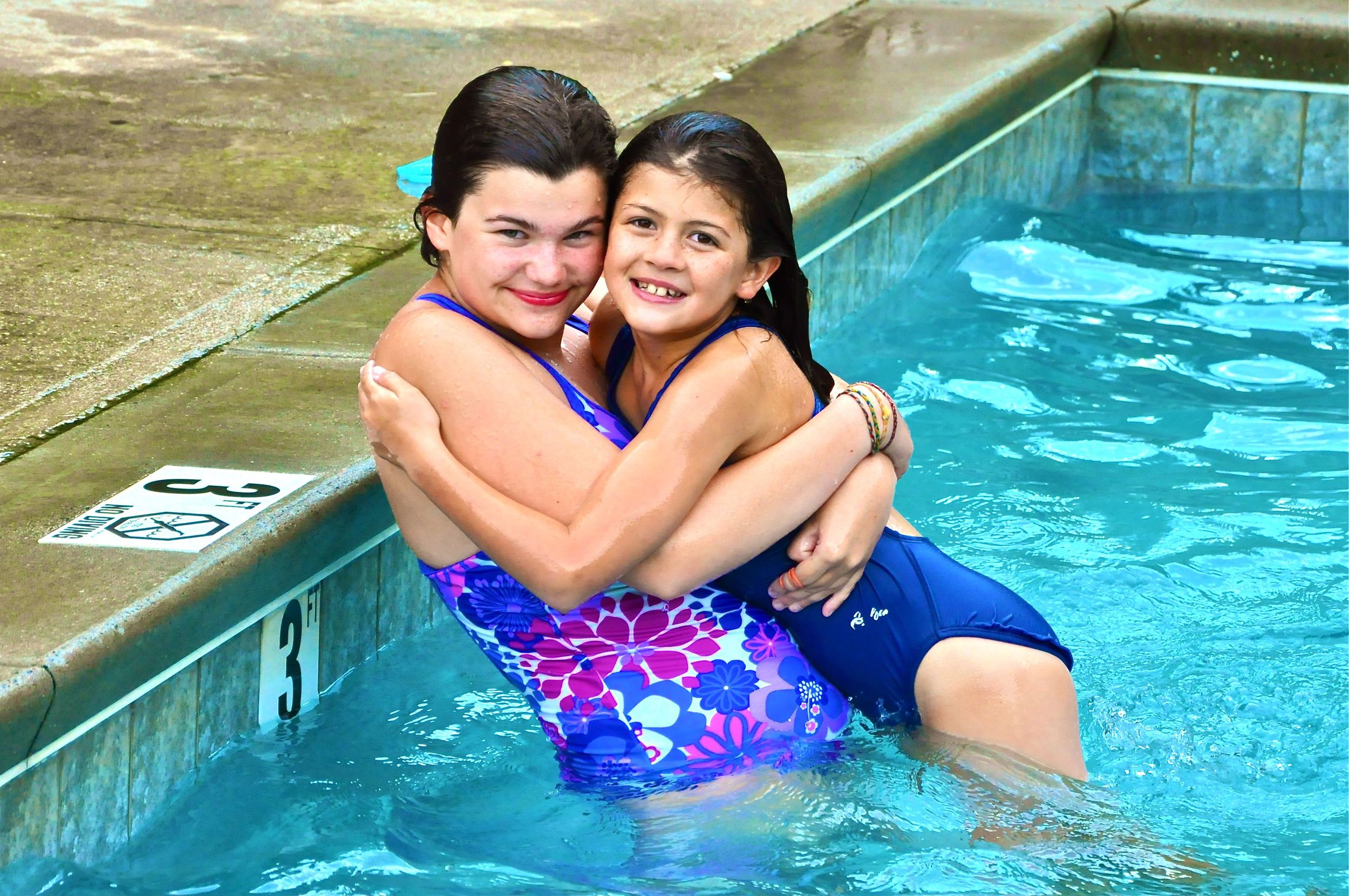 michelle-gives-morgan-a-22big-sister22-hug-in-the-pool-during-a-game-of-water-polo.jpg