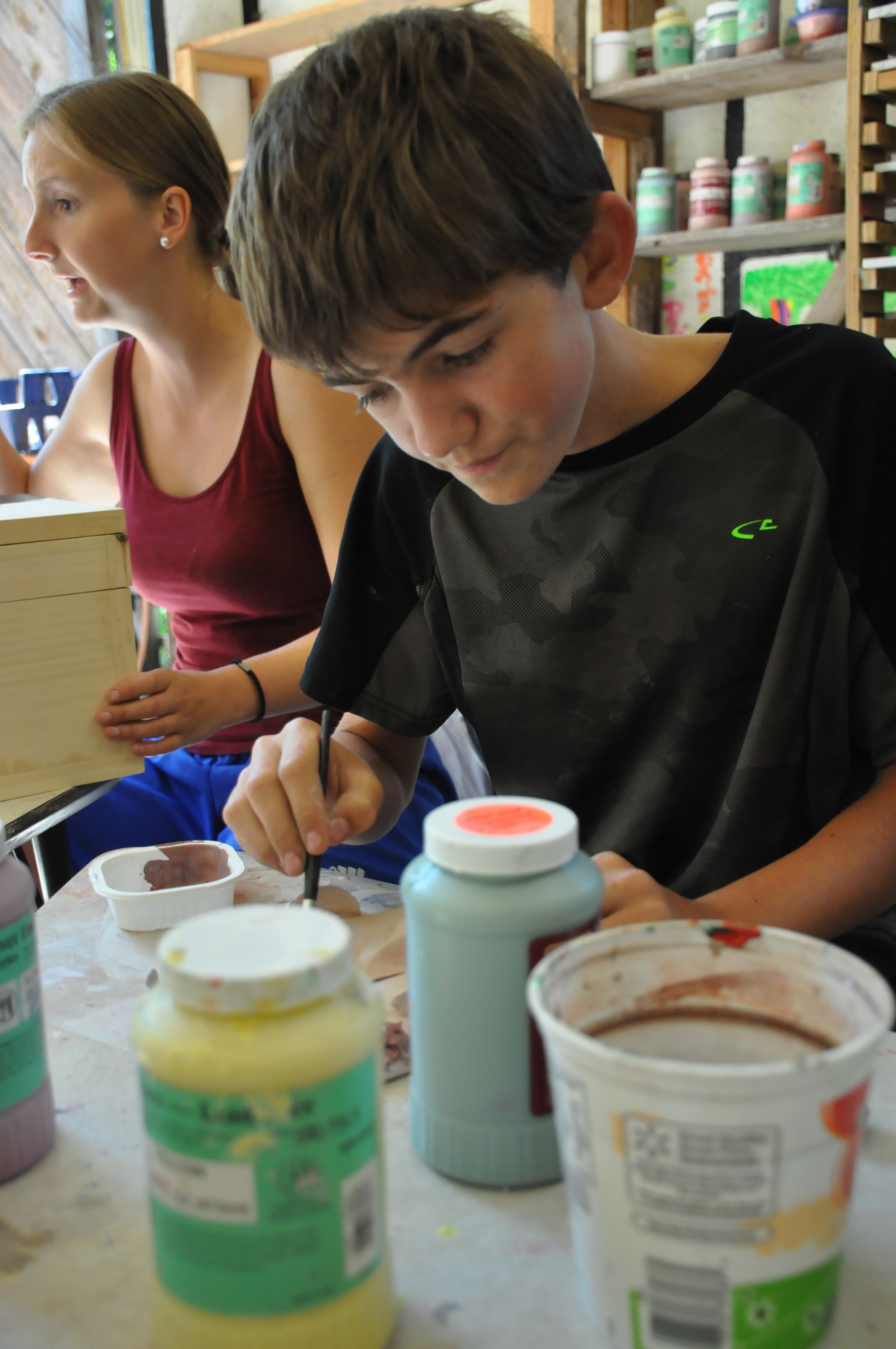 jace-is-glazing-his-clay-during-art.jpg