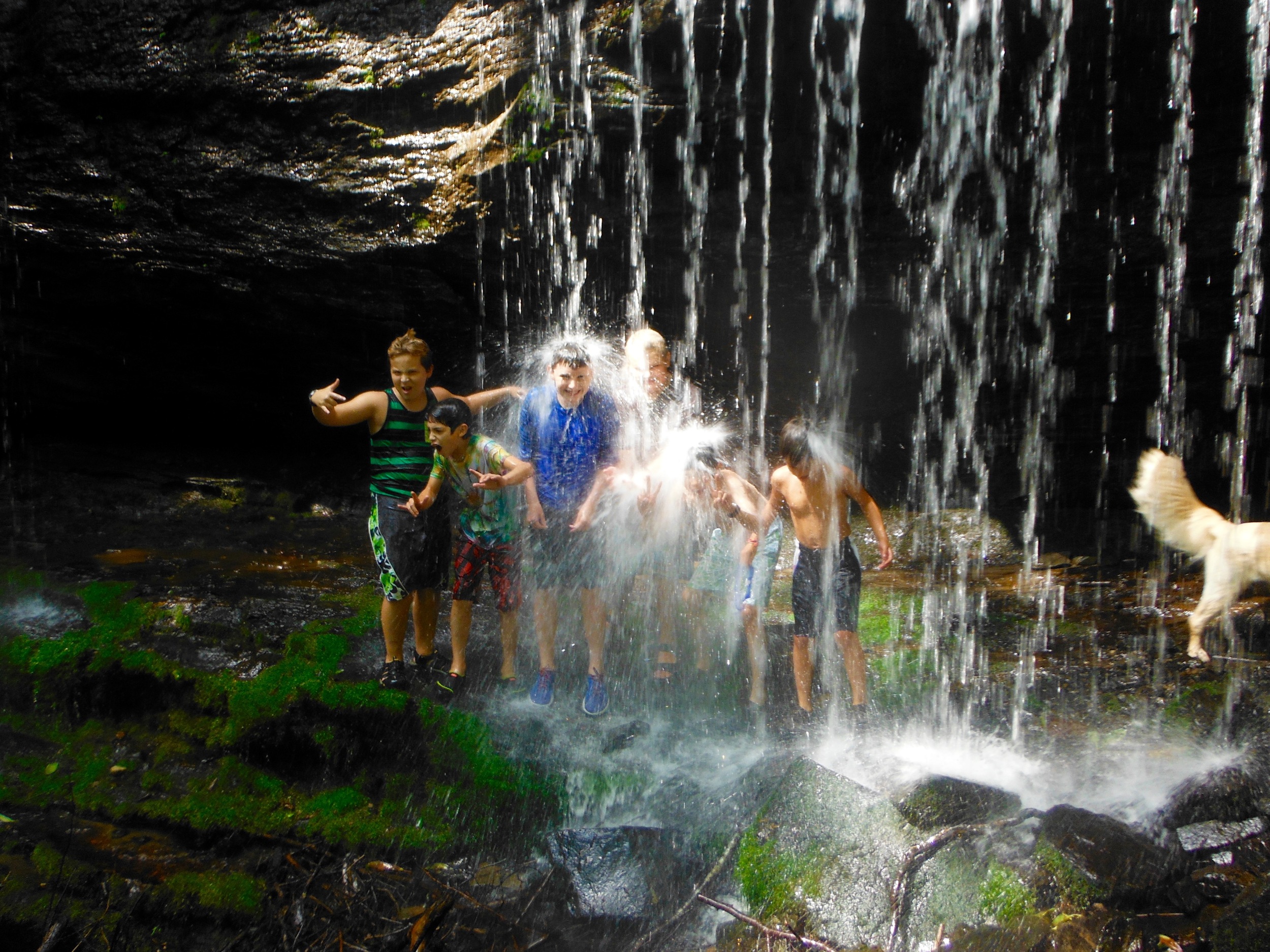 the-junior-boys-get-soaking-wet-under-a-local-waterfall.jpg