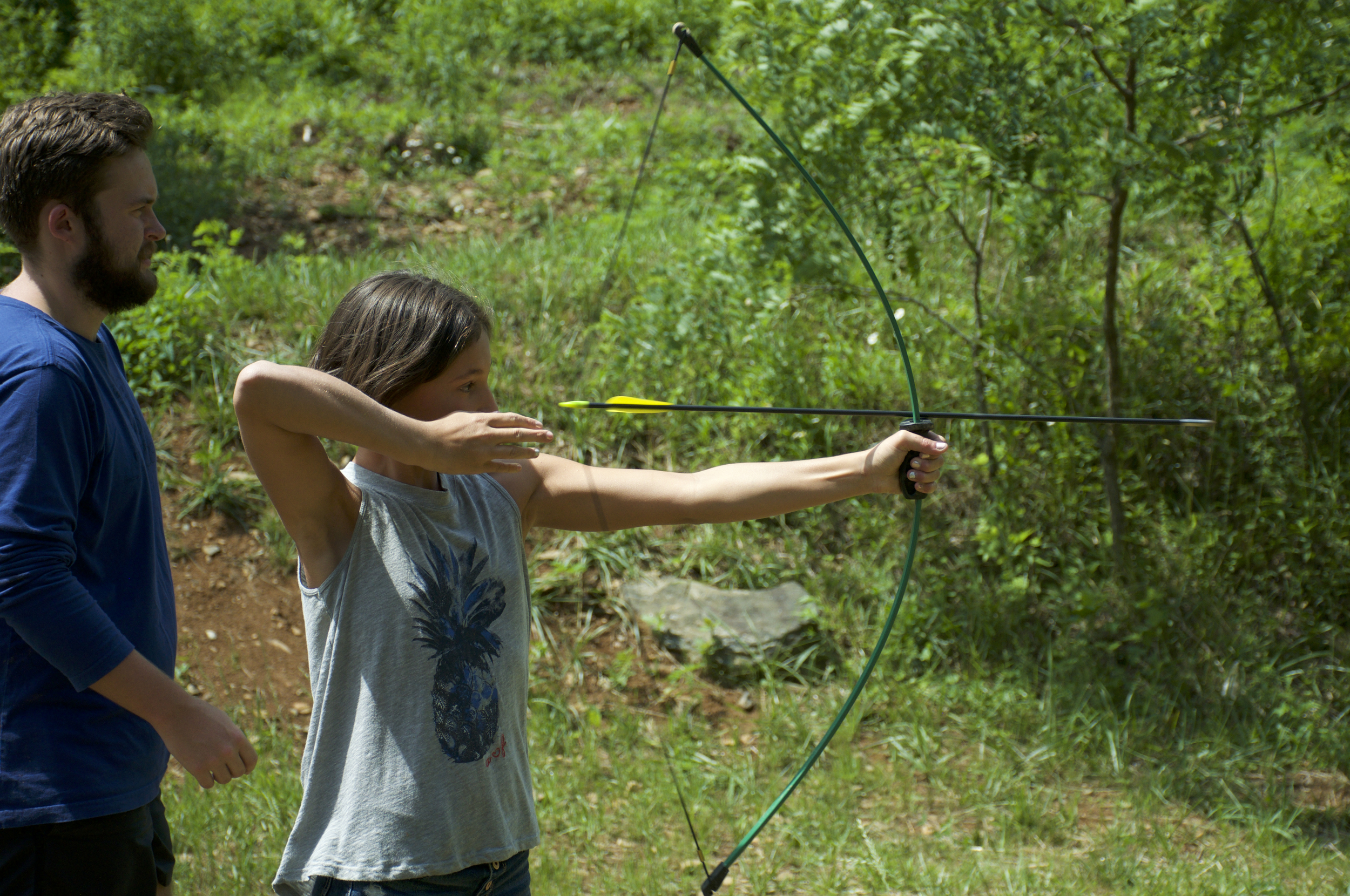 Taking aim in archery. 