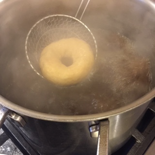 Flipping bagels with a spider.