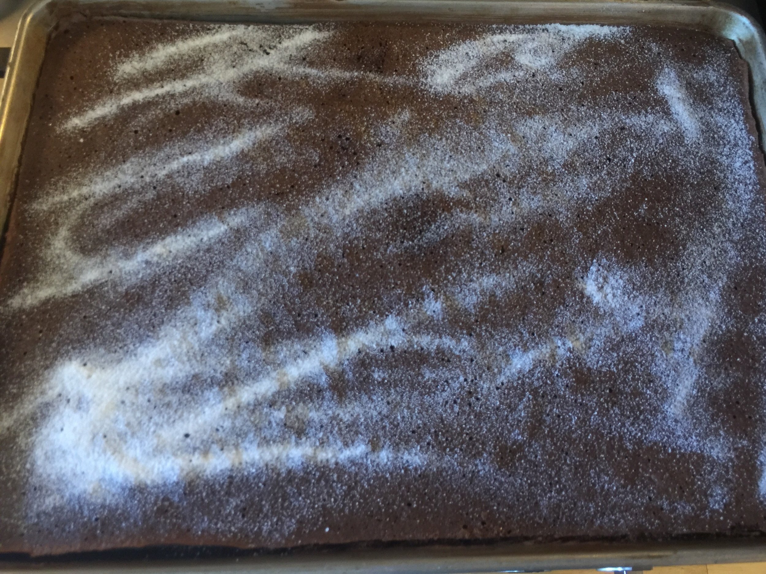 Sugar on top means it will not stick to the parchment paper.