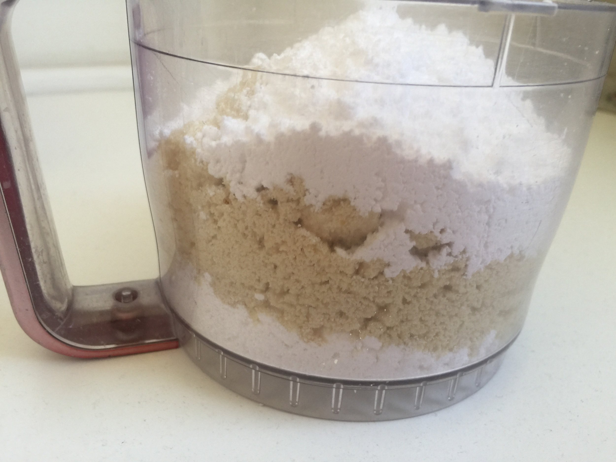 Layered powdered sugar and almond meal