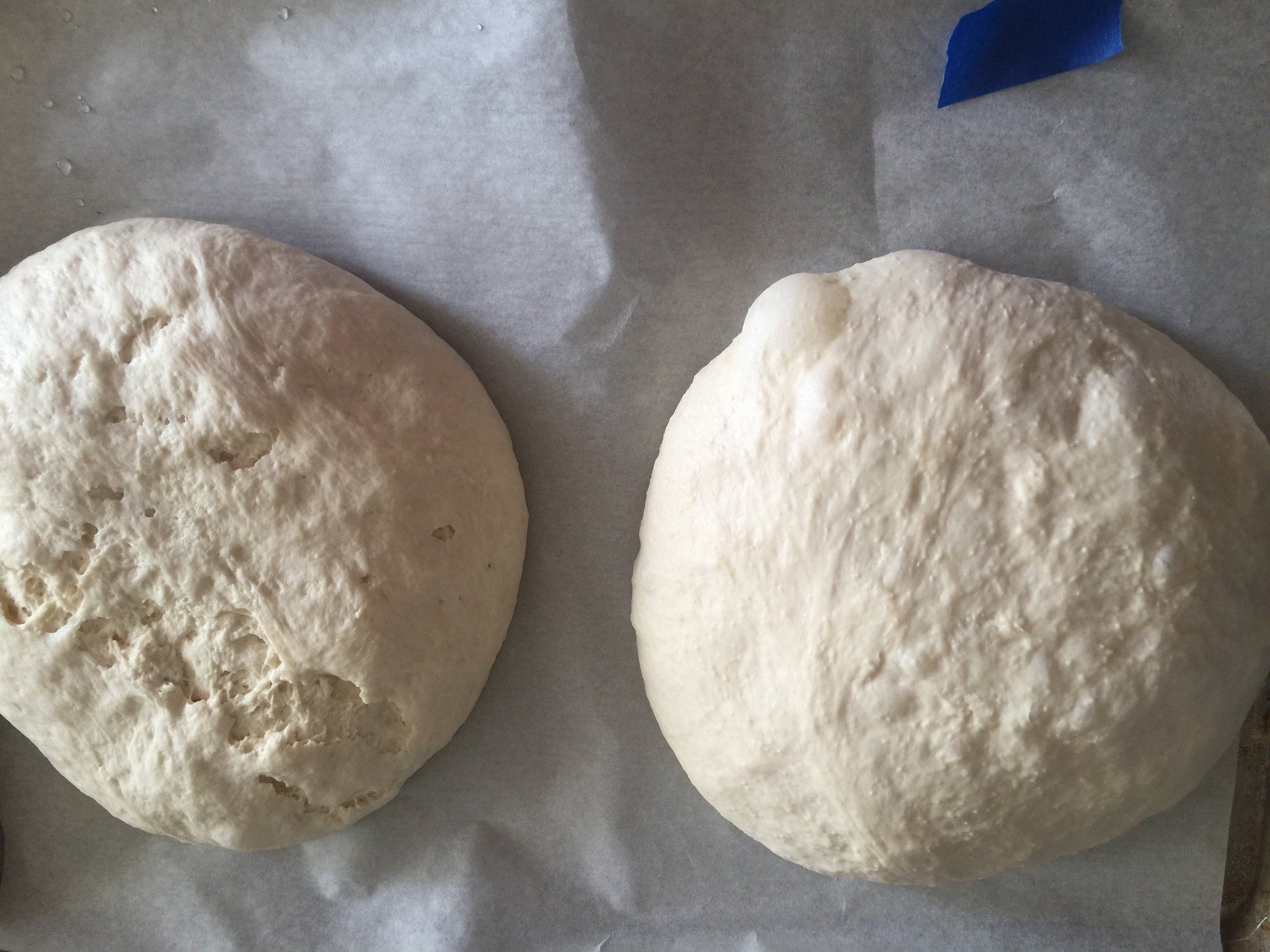 Ready to bake - the surface of the bread flour cracked a little and see the odd texture of the cake flour loaf....but they are the same size now....