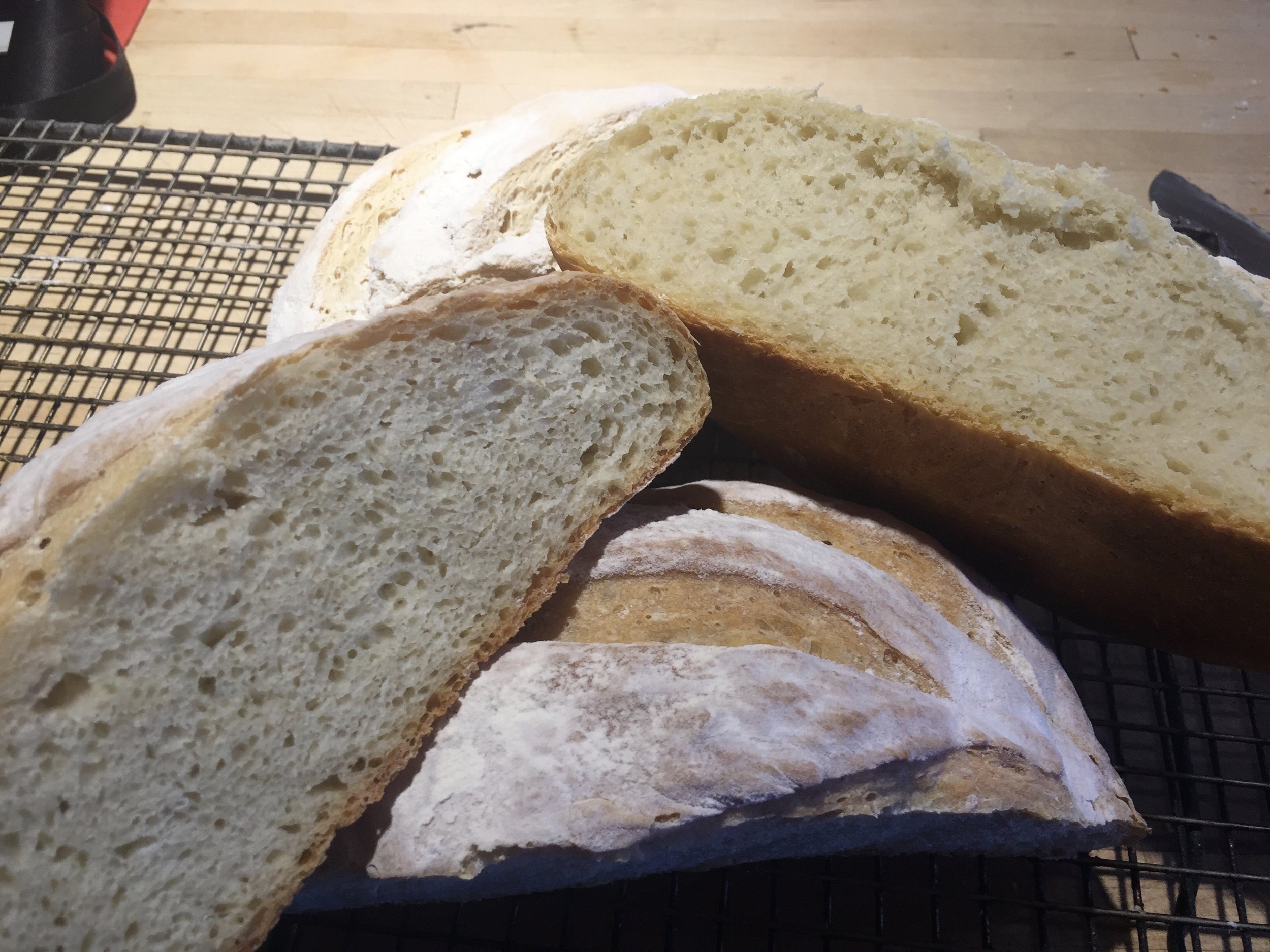 The bread flour loaf has a golden crust and a good crumb - the hydration was low, 71% so I was not expected big air holes in the crumb. Still you can see the cake flour loaf has a cottony crumb and had no crust color. Bleaching flour removes all the carotenoid pigments.