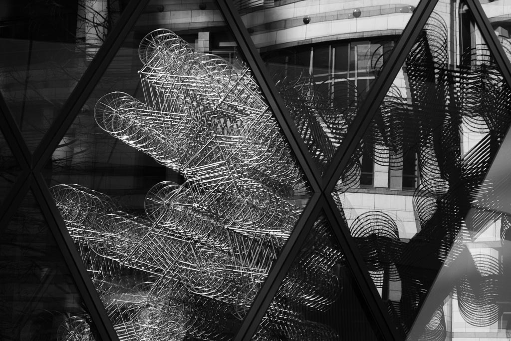 Bicycle sculpture reflection.
