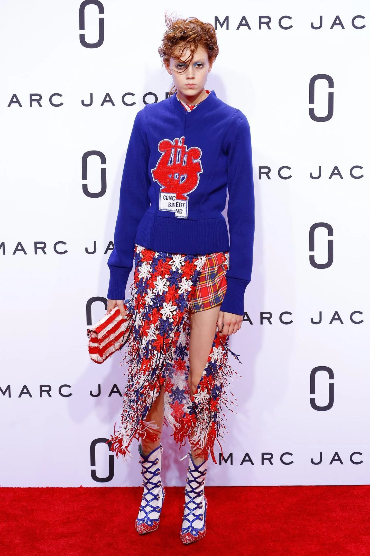 Model Natalie Westling poses on the Marc Jacobs red carpet before strutting down the runway; image via