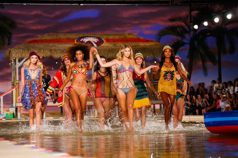 From L to R: models Stella Maxwell, Imaan Hammam, Gigi Hadid and Jasmine Tookes splash around in Hilfiger's makeshift tidal pool; image via