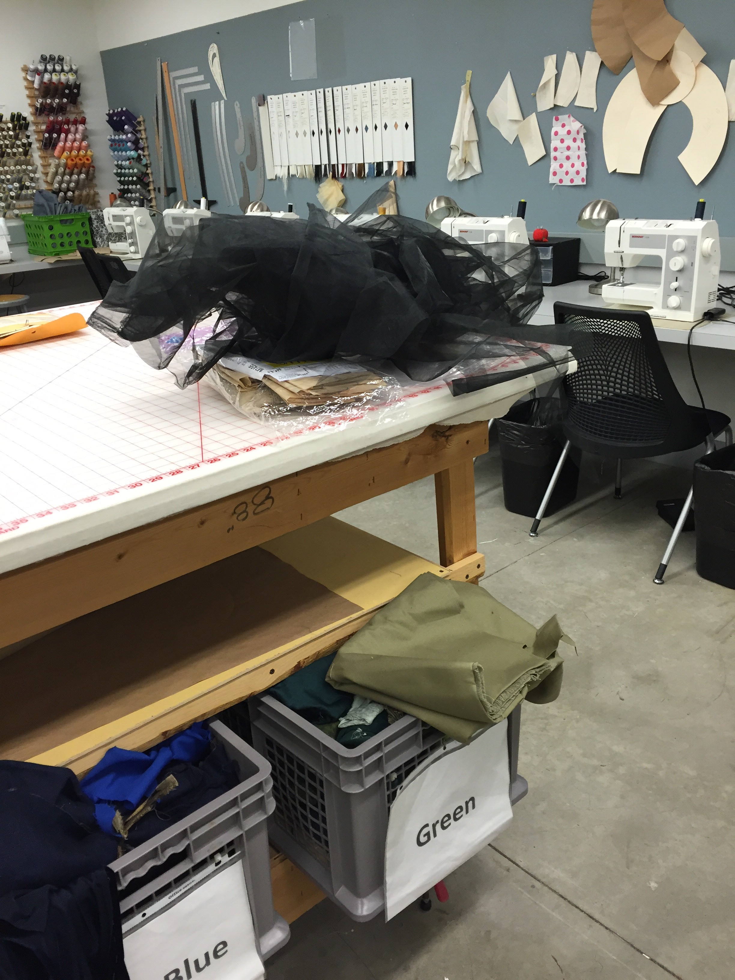 "Playing with and testing the drape of material in the costume shop"