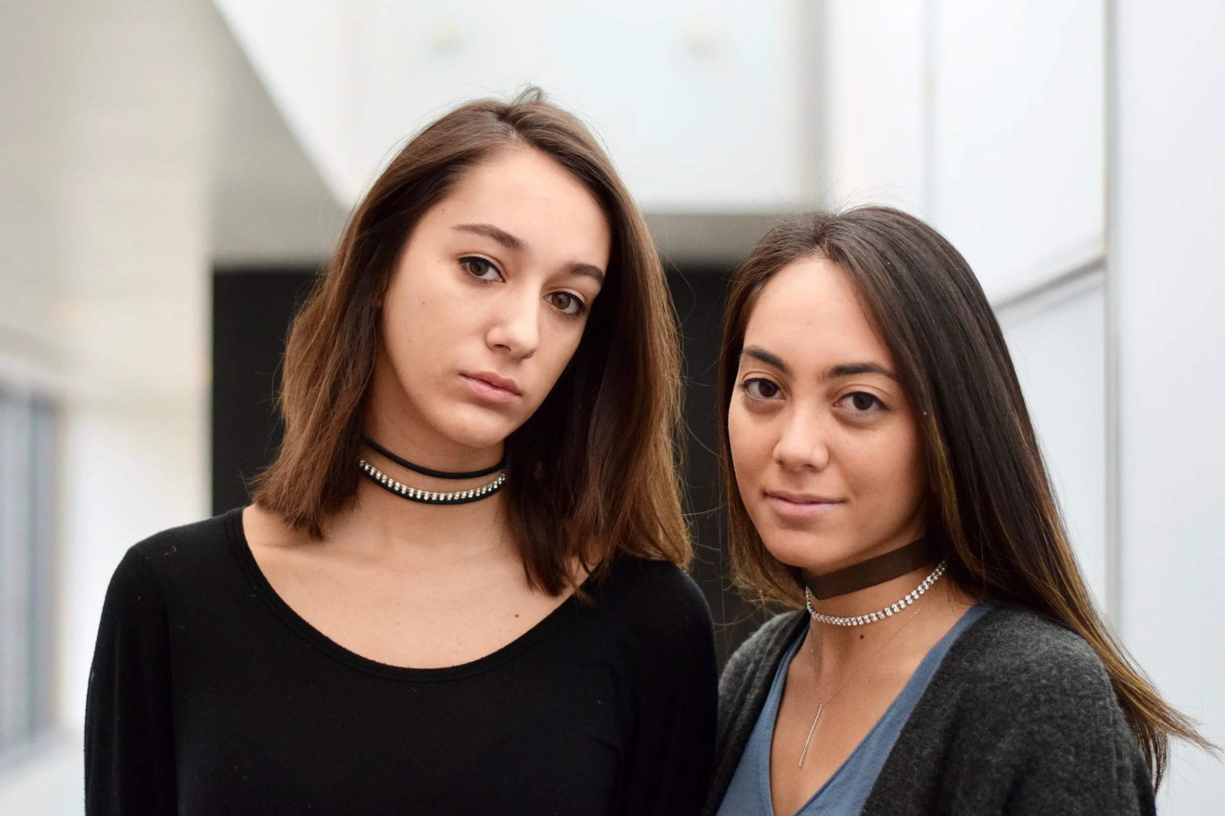 Gabrielle is wearing The Gigi II; Shereen is wearing The Kate with a crystal choker.