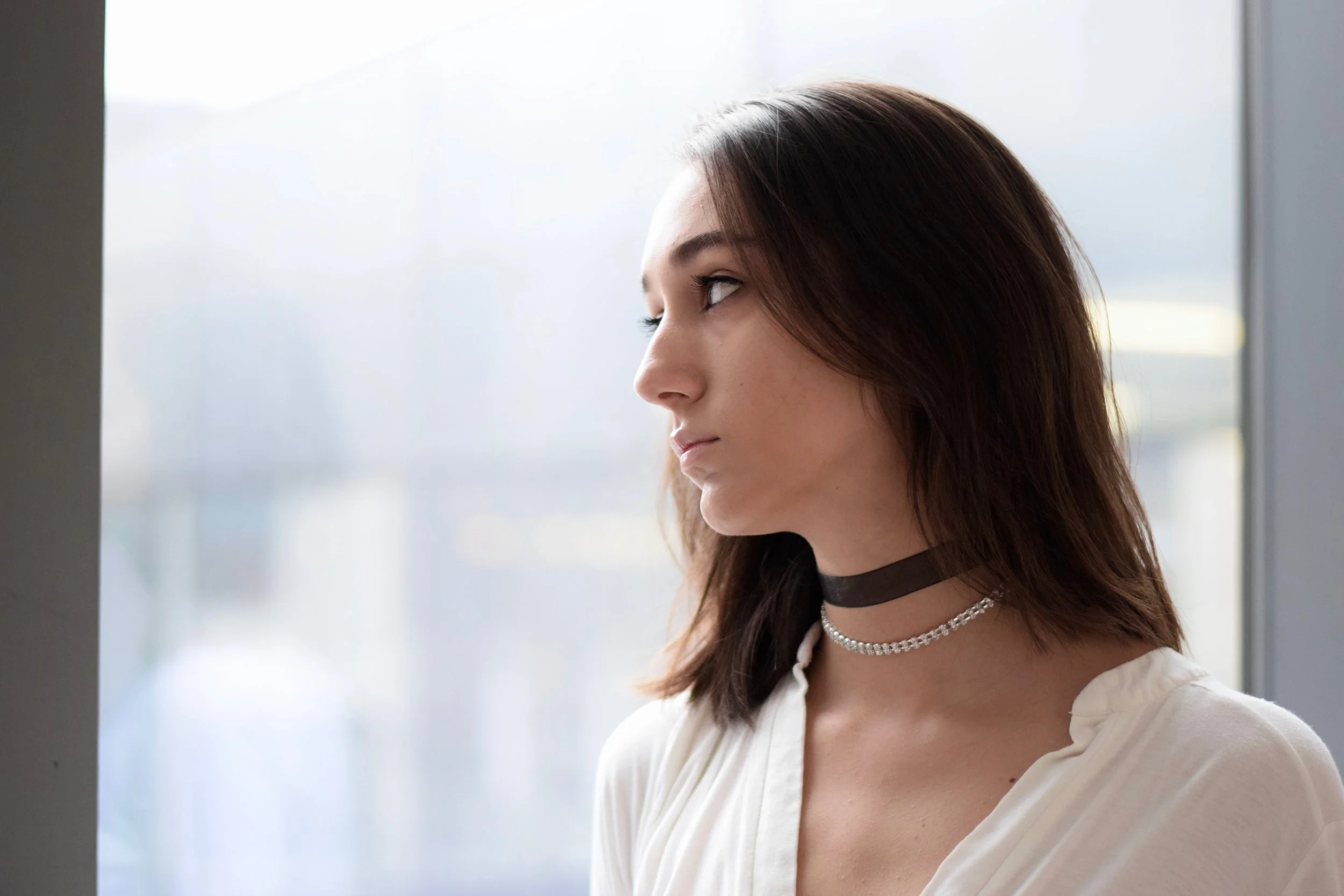Gabrielle is wearing The Kate with a crystal choker.