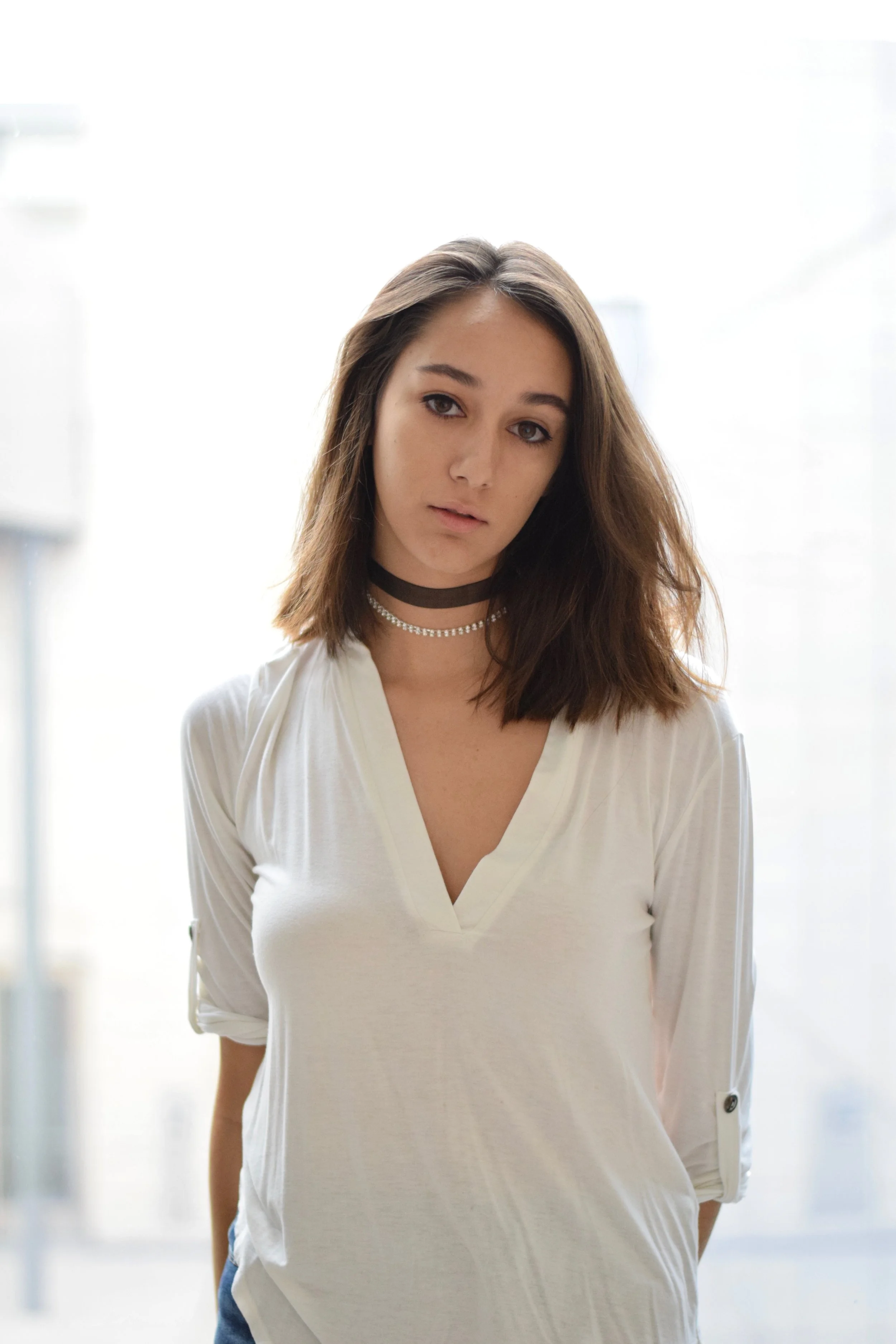 Gabrielle is wearing The Kate with a crystal choker.