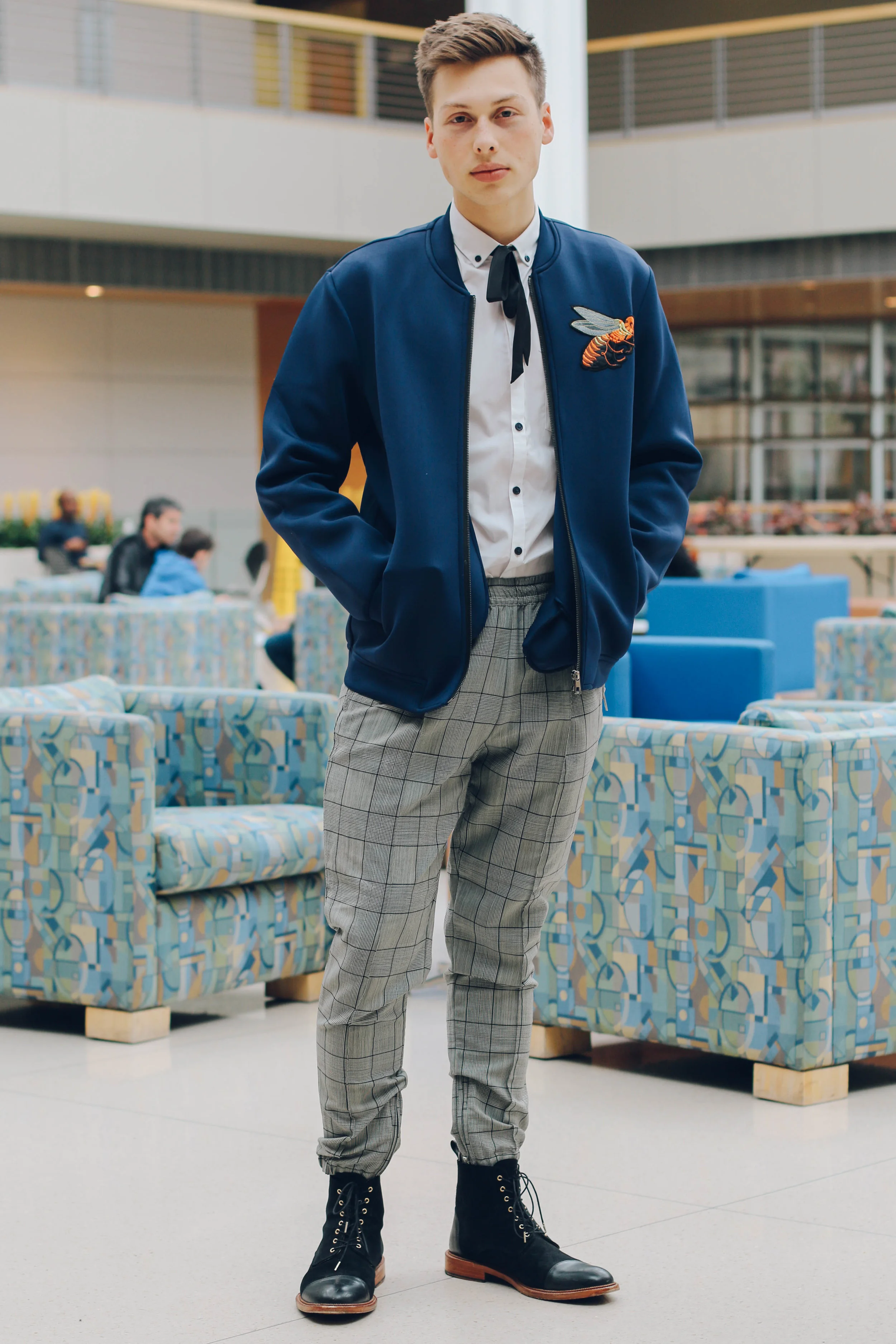 My second look I’m wearing is Kris Van Assche Wool Jogger Pants , a Top Man button down, a bomber jacket from a market in China, a thrifted neck bow, and Taft Jack Boots.