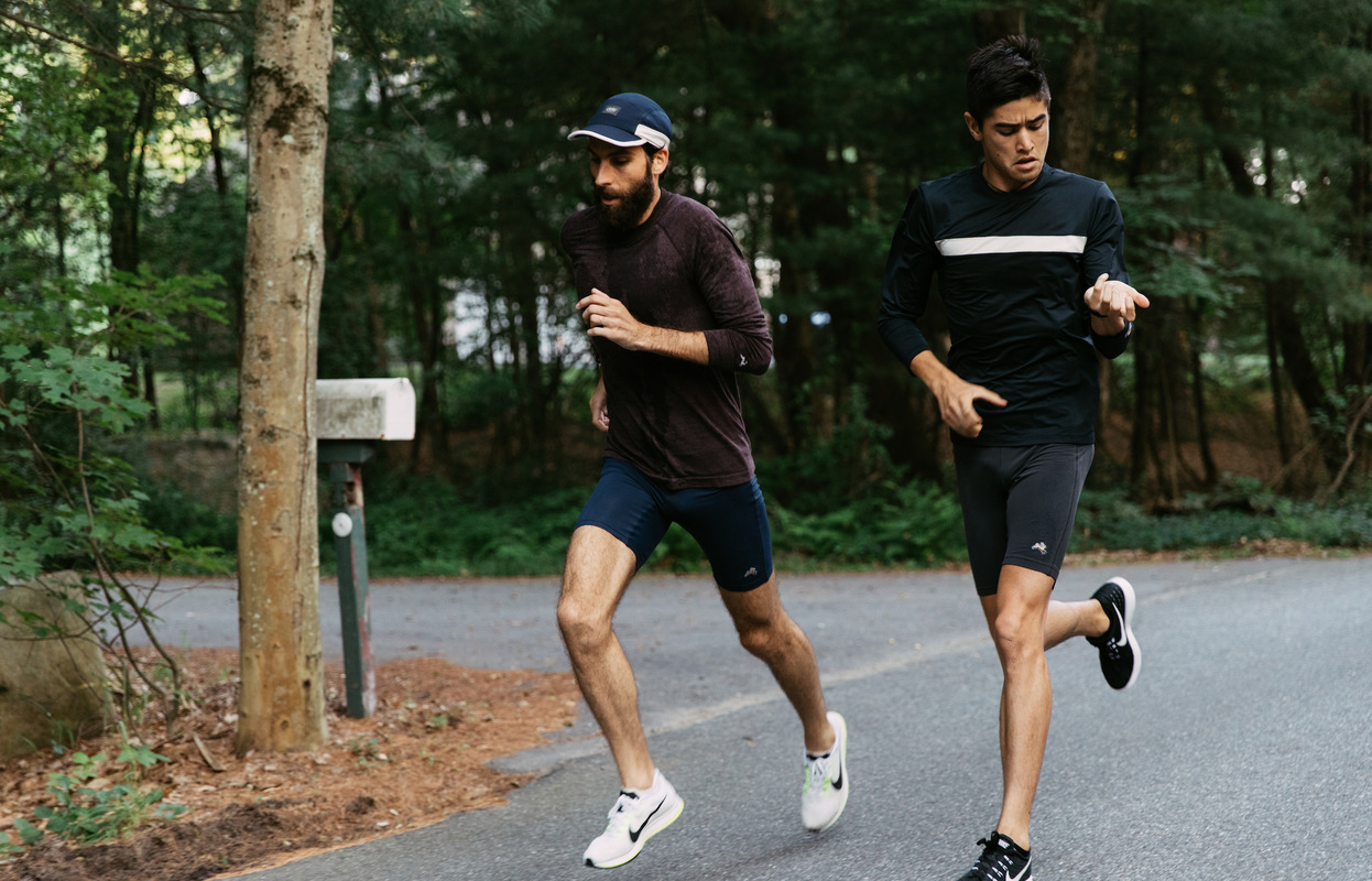 Rafa rocks the Brighton Base Layer ($85) in Wine and Reggie Half Tights ($68) in Navy . Mike features the Twilight Long Sleeve ($58) in Black and Reggie Half Tights ($68) in Phantom Black .