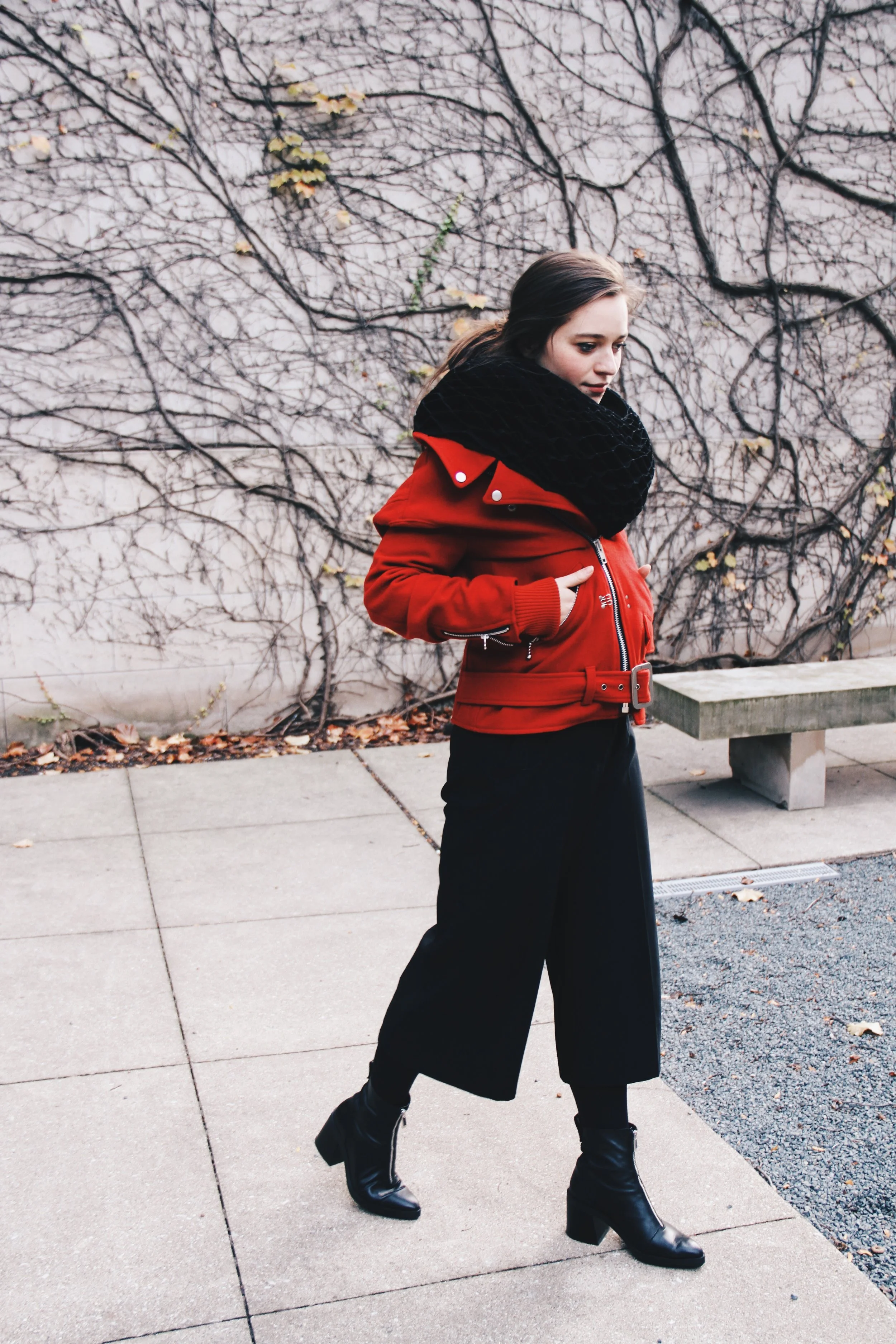 I’m wearing my favorite piece, a red Junya Wantanabe coat with attached ruff scarf, my go-to Zara culots and heeled zip-up boots.