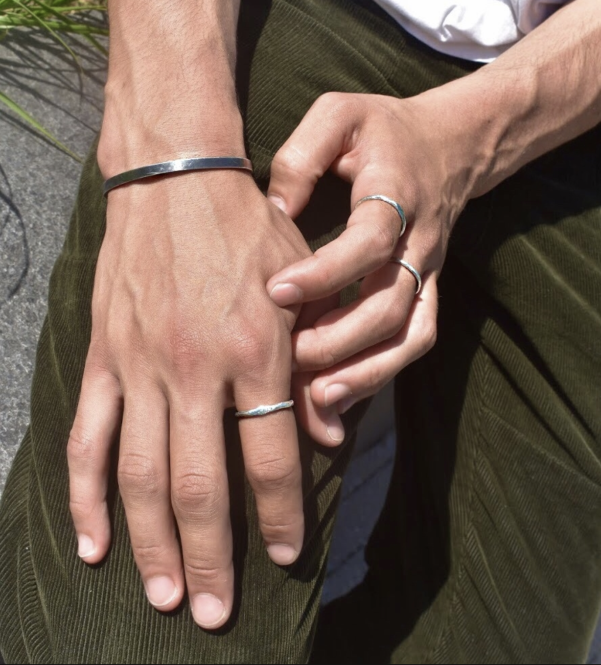 My first piece of jewellery - a Le Gramme cuff - paired with Pearls Before Swine rings.