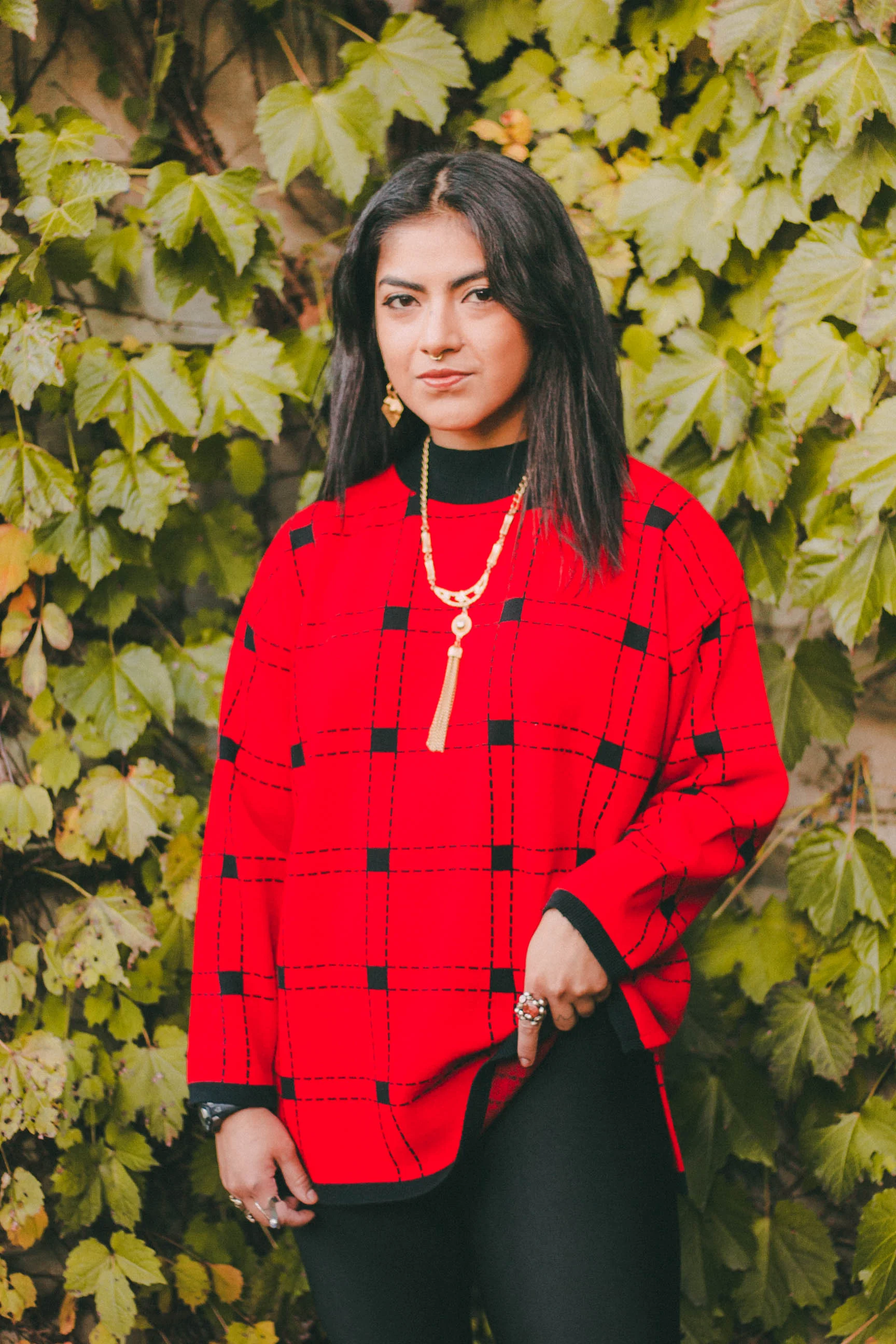 I thrifted this vibrant red sweater from Village Discount, the brand is Karen Lessly. The shiny leggings are Boohoo and my Timberland boots are from DSW.