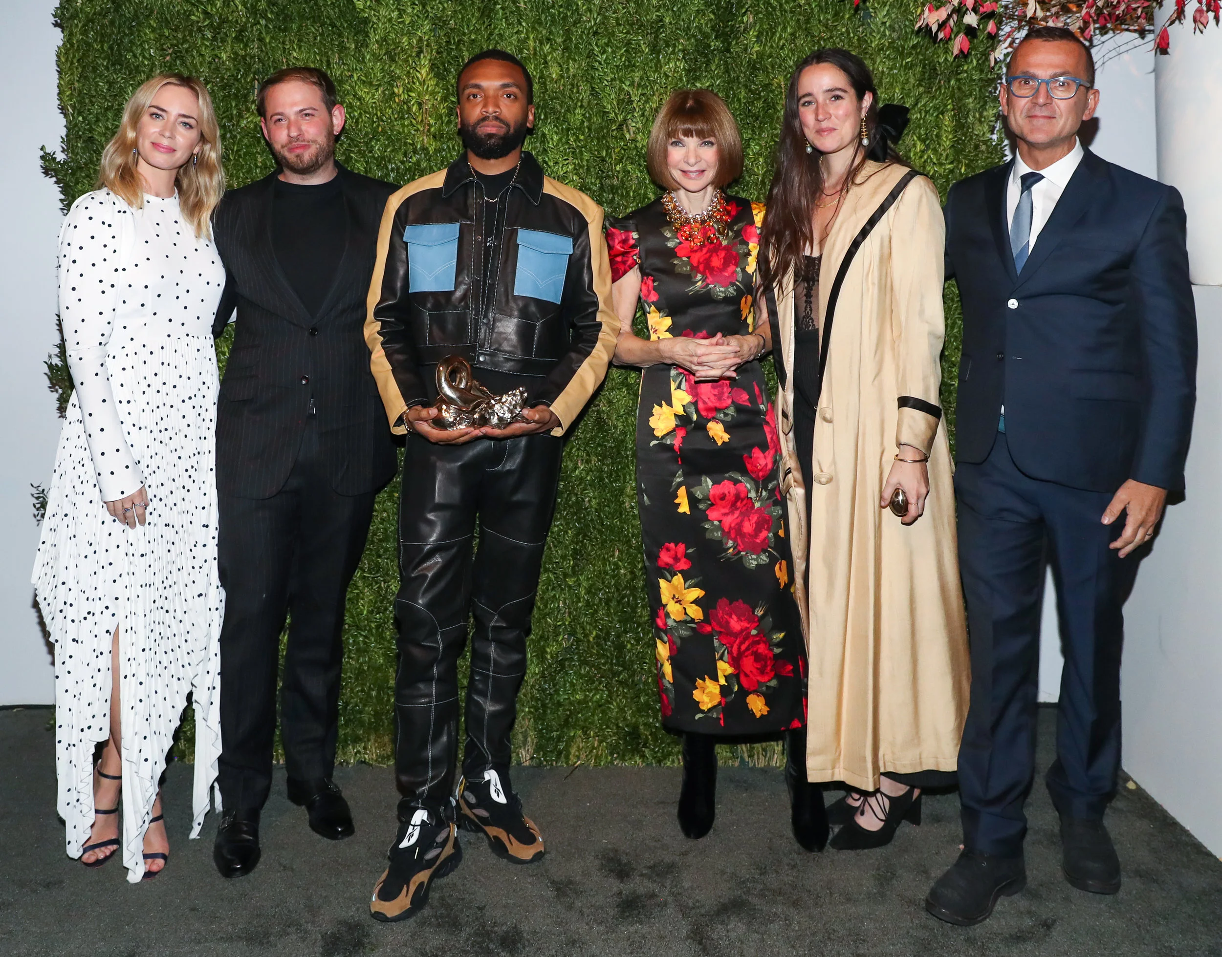 Pictured from left to right: Emily Blunt (presenter of award), runner-up Jonathan Cohen, winner Kerby Jean-Raymond, U.S. Vogue EIC Anna Wintour, runner-up Emily Adams Bode, and CFDA chief executive Steven Kolb. Image via.