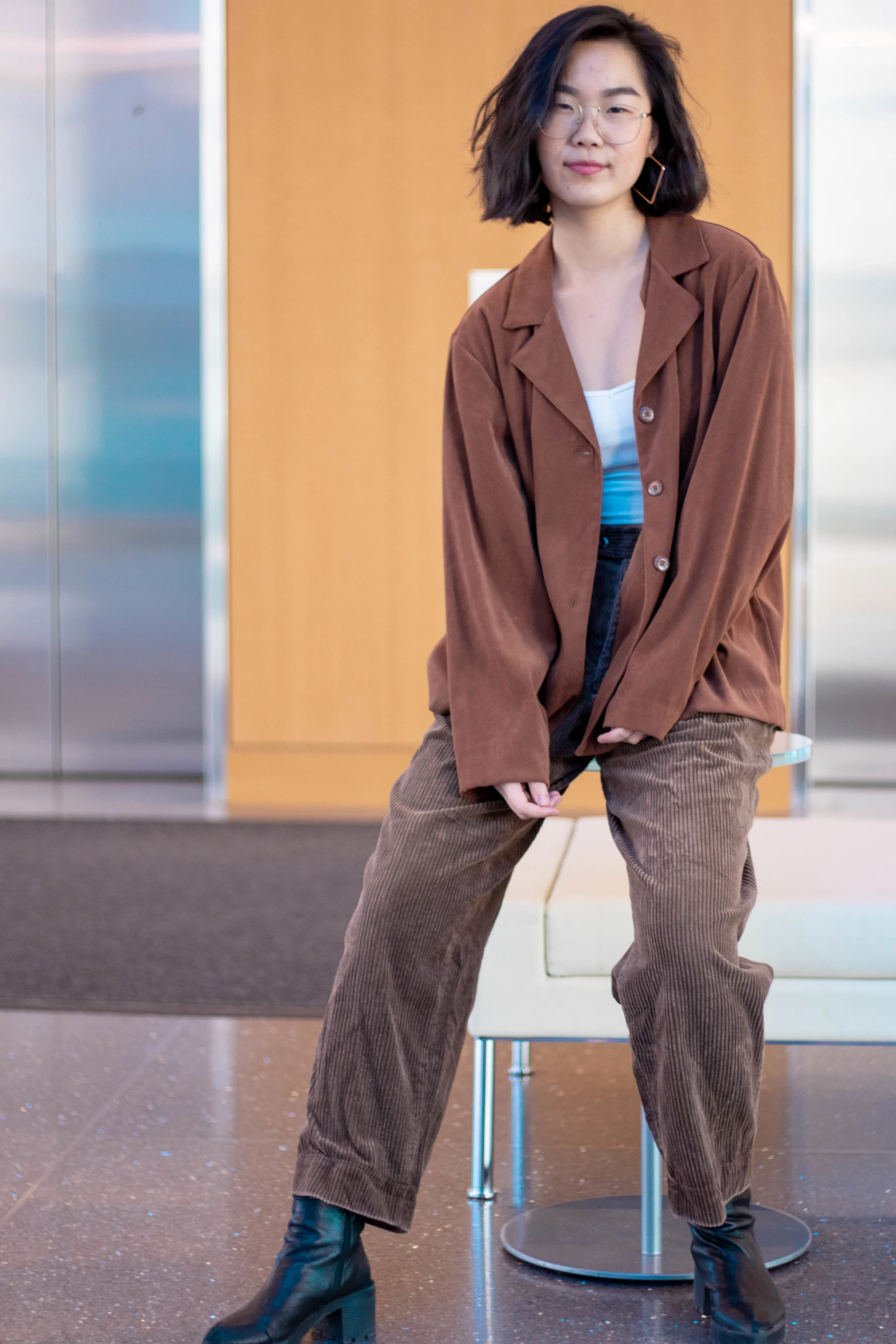 This ensemble is made up of a tank from H&M, pants from my grandma (who literally has the same waistline as me), and a jacket thrifted from Village Discount. The boots for both outfits were bought from a girl on campus for $5! Still happy with myself for that one.