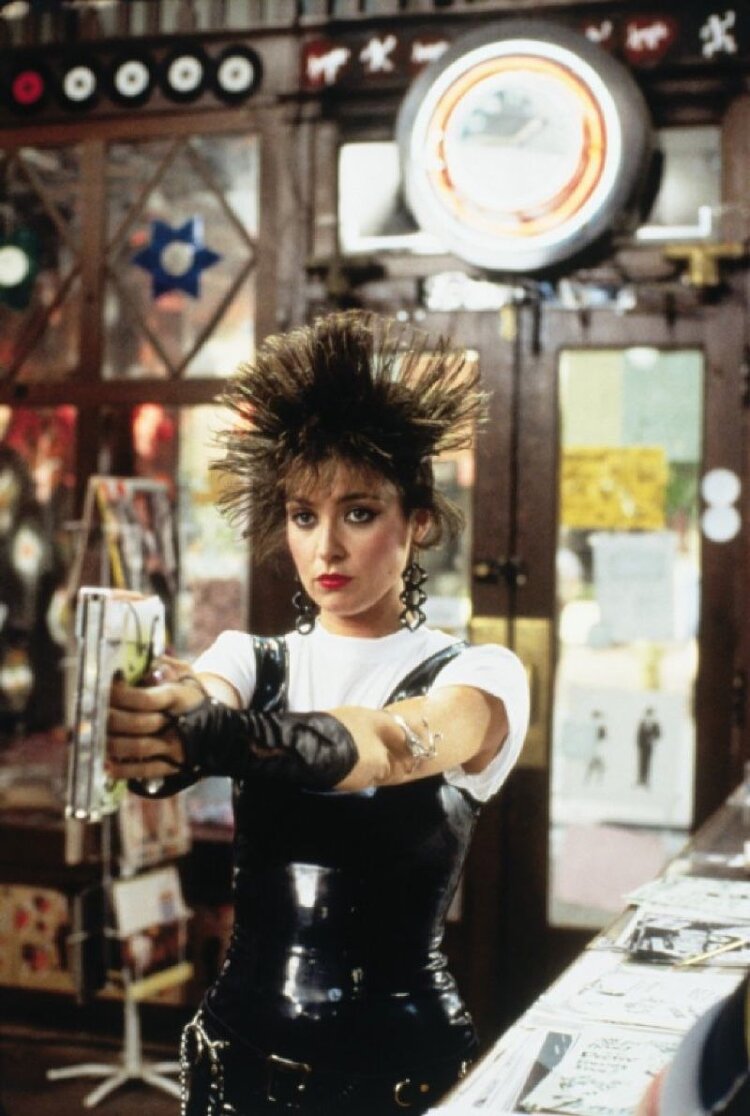 Iona (Annie Potts) shortly after assailing Duckie with staples. Image  Via