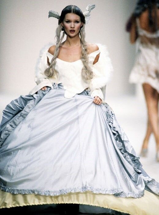 Kate Moss walking the runway for John Galliano’s Spring/Summer 1994 show. Image via