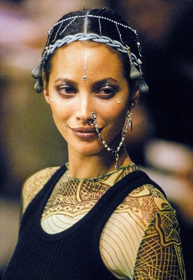 Christy Turlington walks for Jean-Paul Gaultier spring 1994, a highly problematic collection. Image via