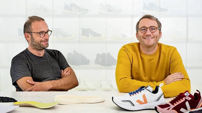 VEJA founders Sebastien Kopp and François-Ghislain Morillion with VEJA running shoes. Image  Via