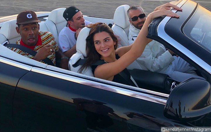 Arthur Kar driving a Rolls Royce Dawn with Kendall Jenner in shotgun and Tyler, The Creator seated directly behind. Image Via